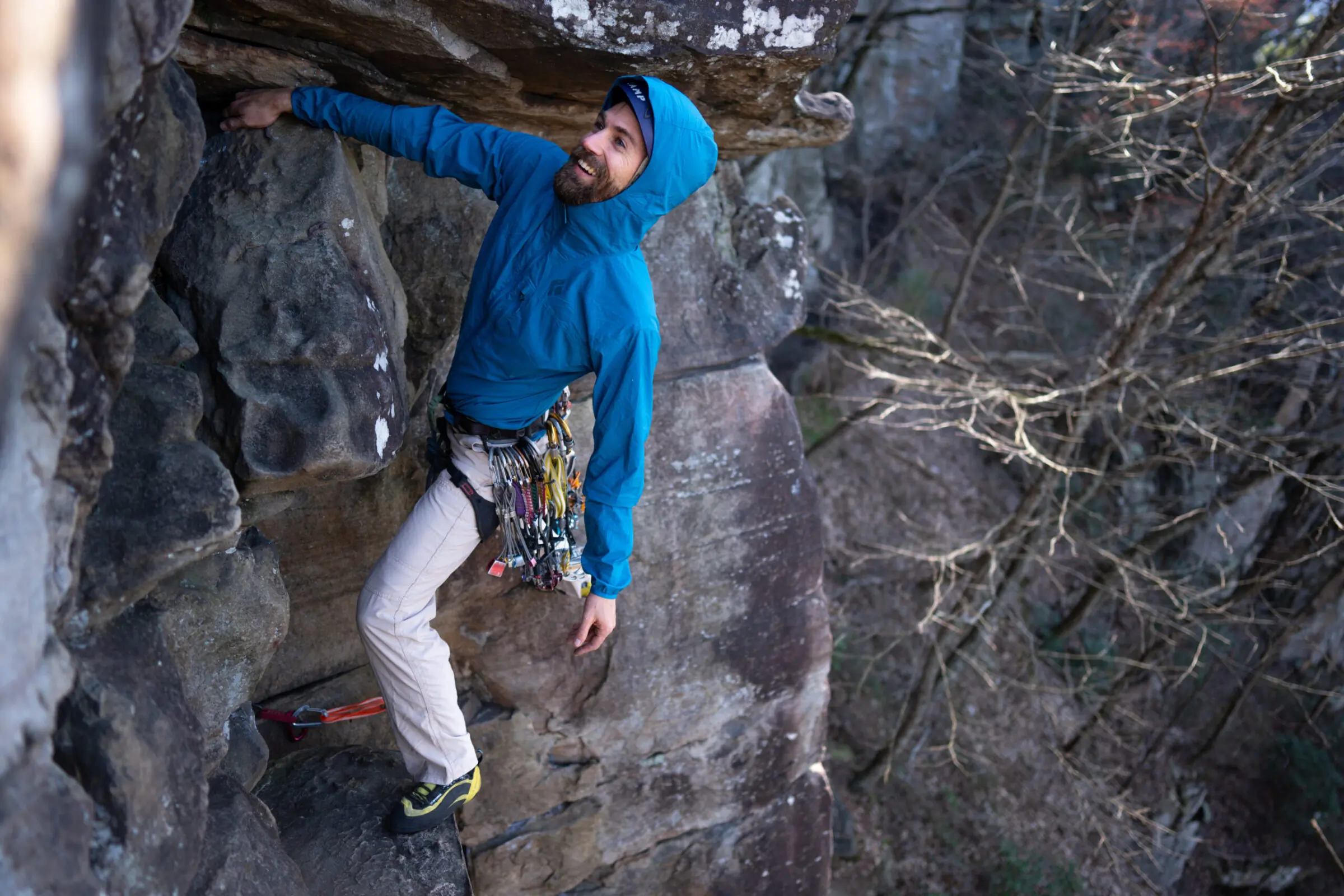 Man rock climbs while wearing a the Black Diamond Alpine Start