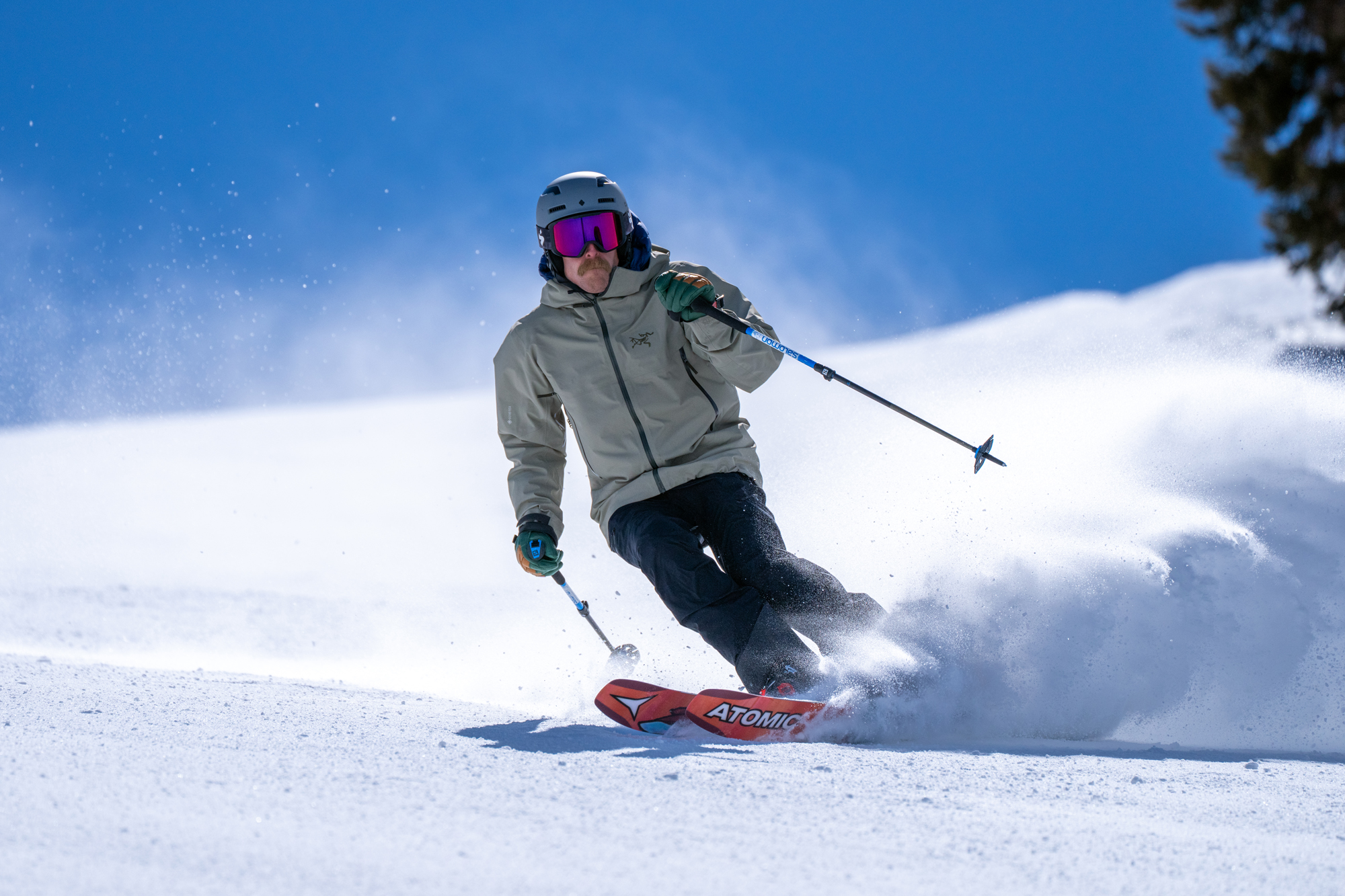 Alpine skier carving with Atomic all-mountain skis