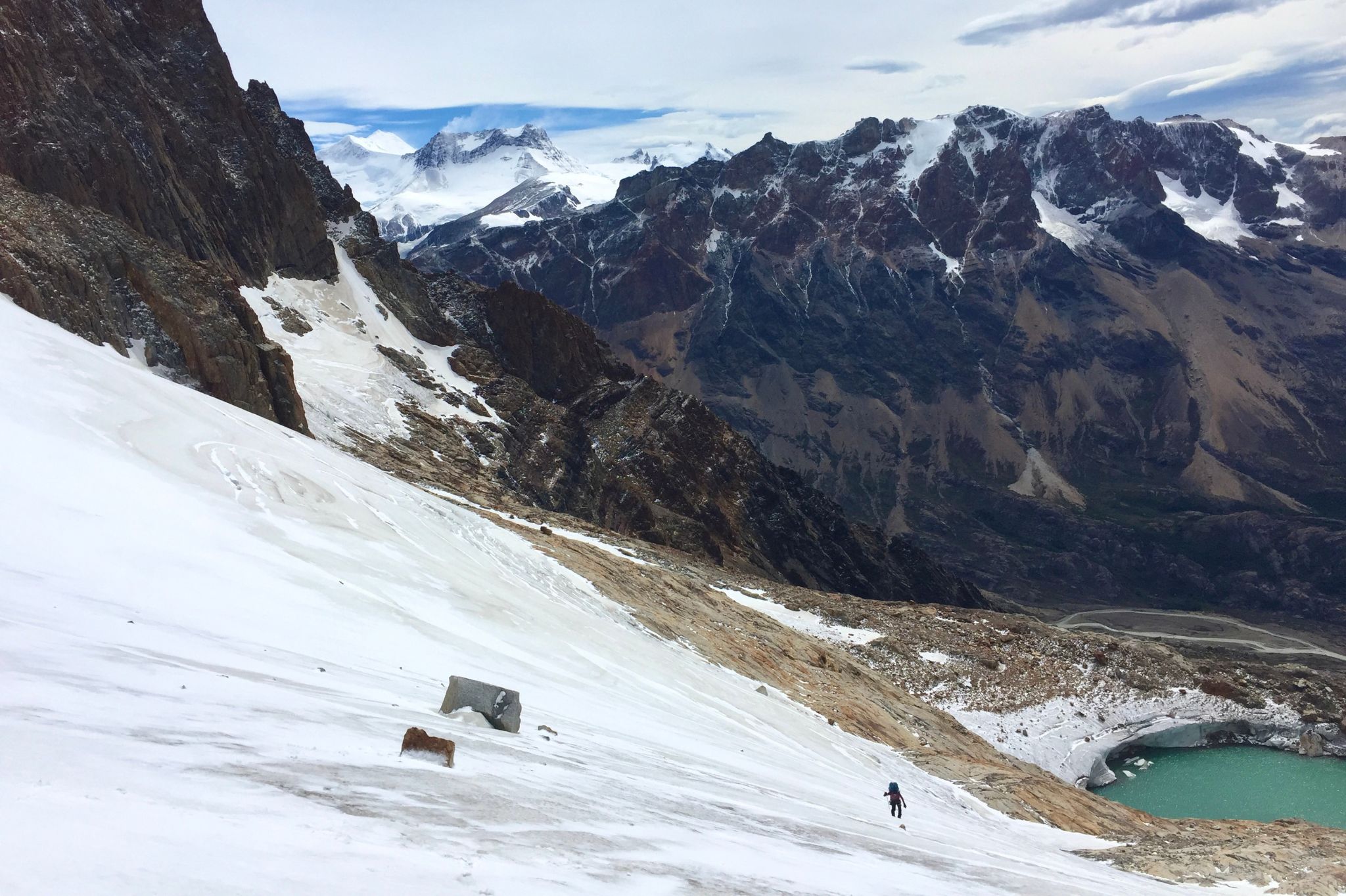 person crosses glacier