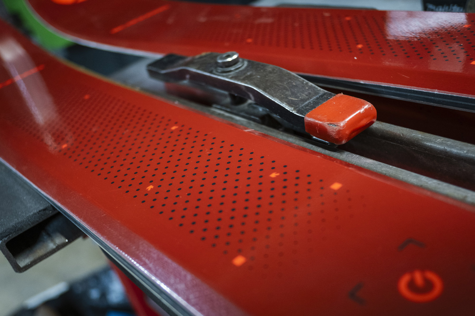 Detailed view of the Blizzard ski surface showing the top sheet texture and binding