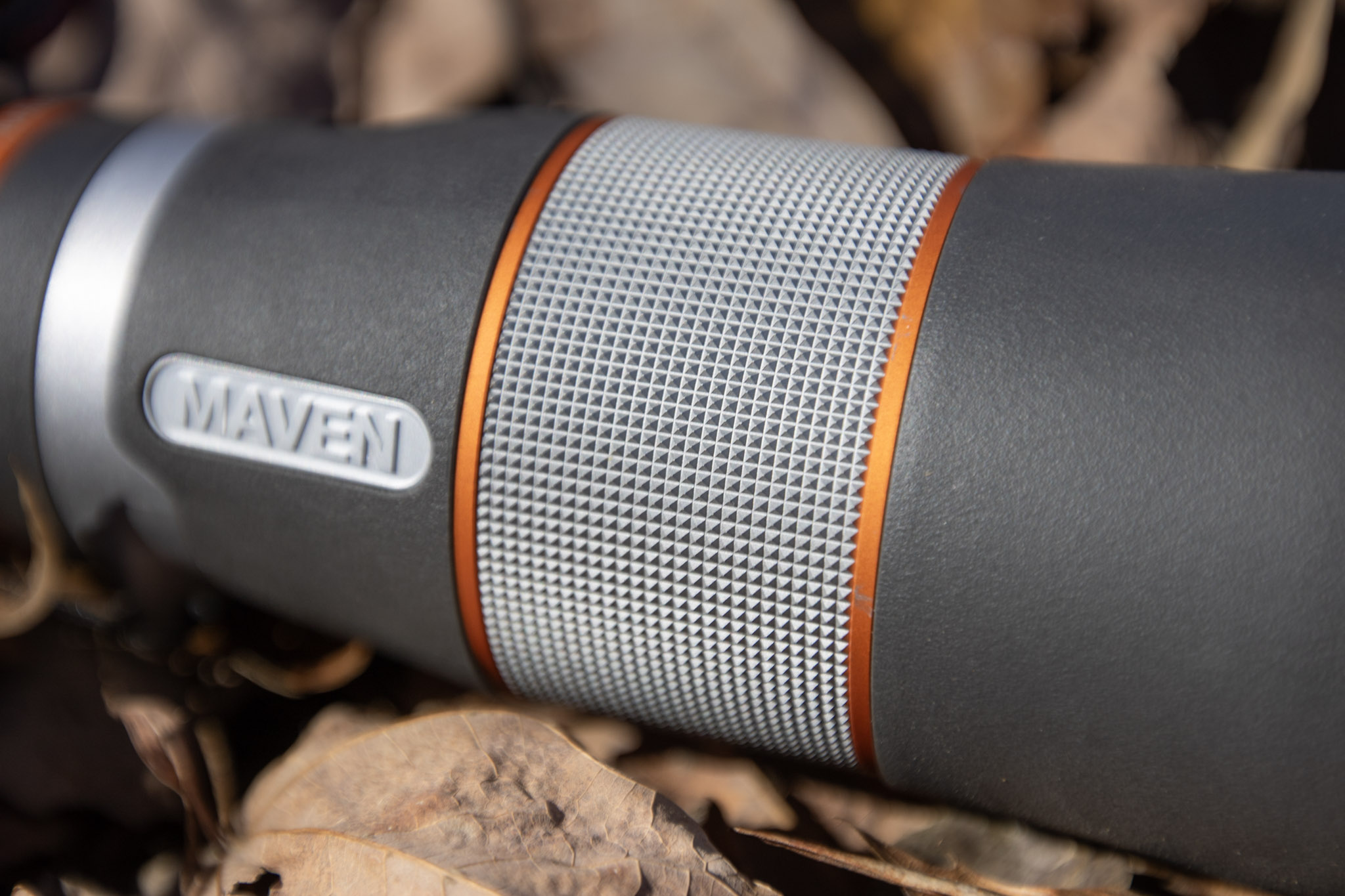 A close up view of the focus wheel on a monocular.