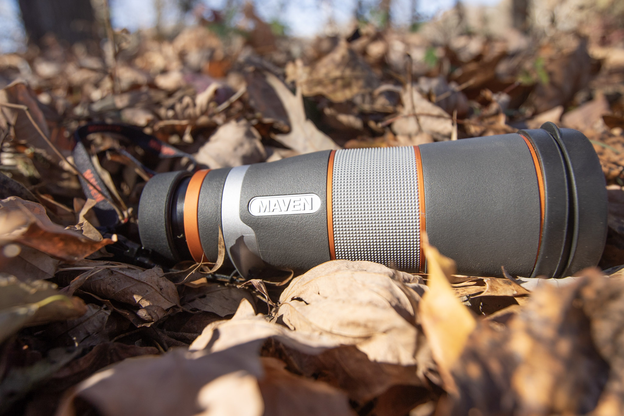 The Maven M.2 Monocular in leaves