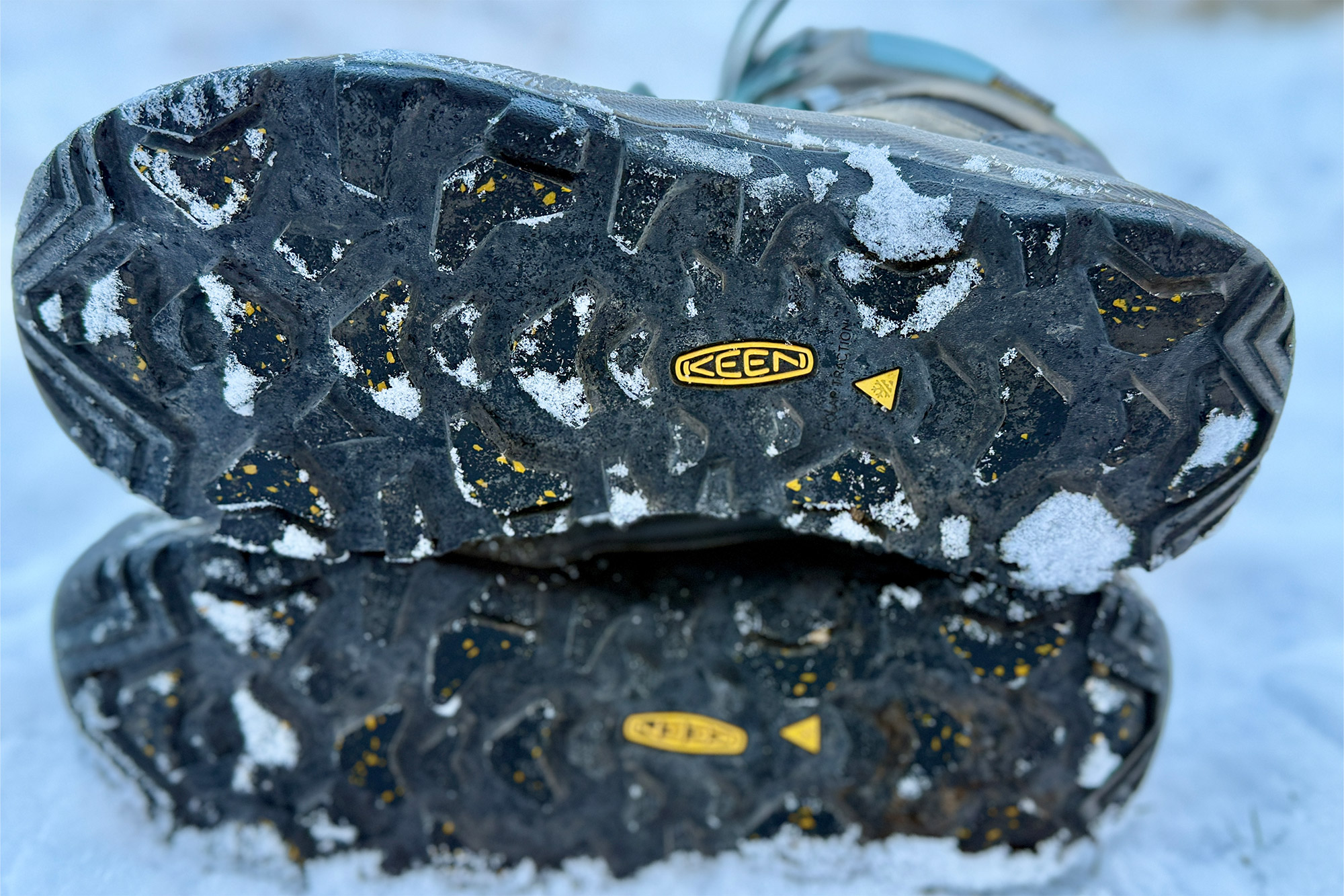 Bottom tread of Revel IV Polar boots showing traction pattern with snow stuck in grooves
