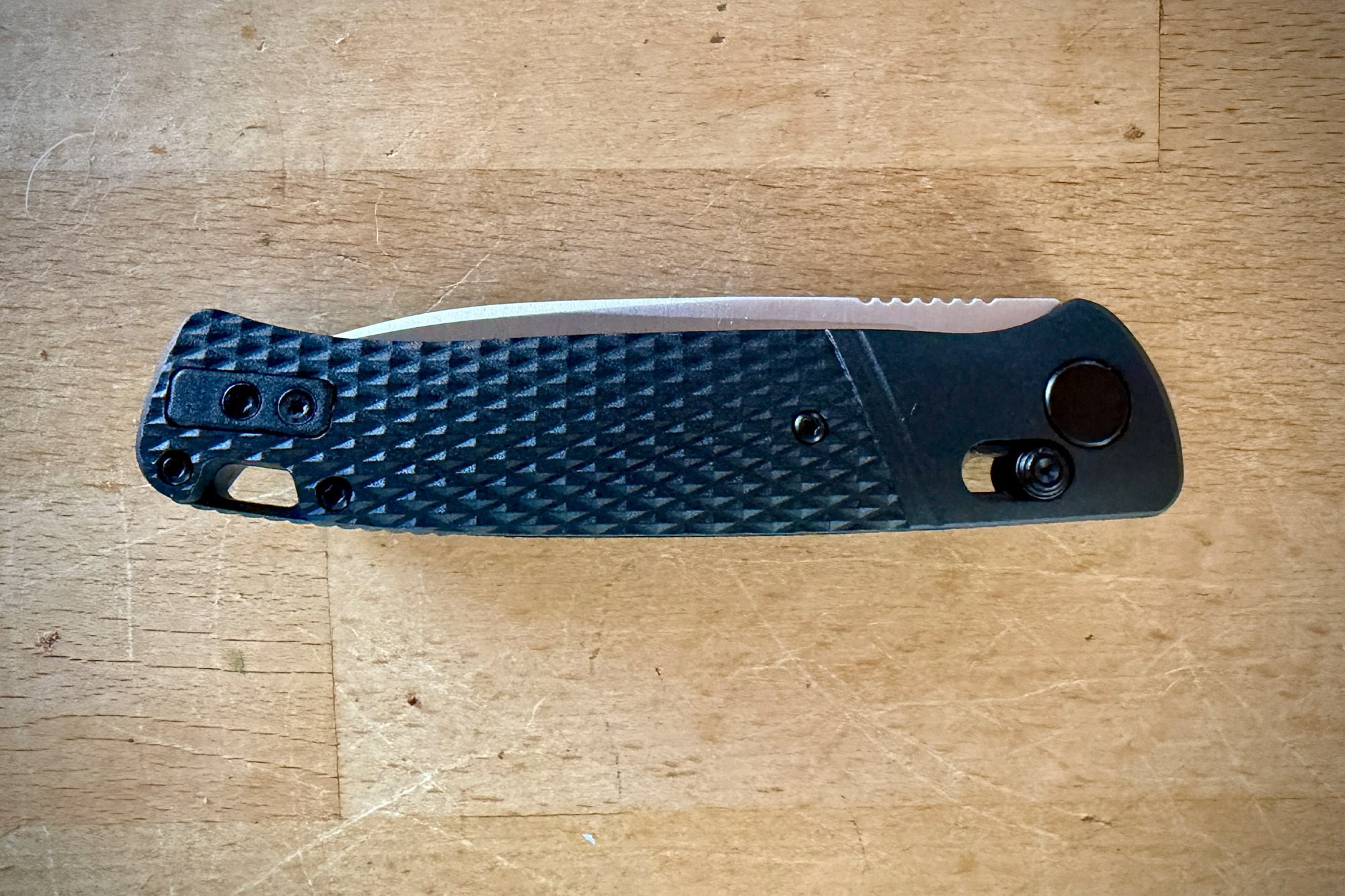 Side view of the closed Counterpart knife showing the textured handle and pocket clip