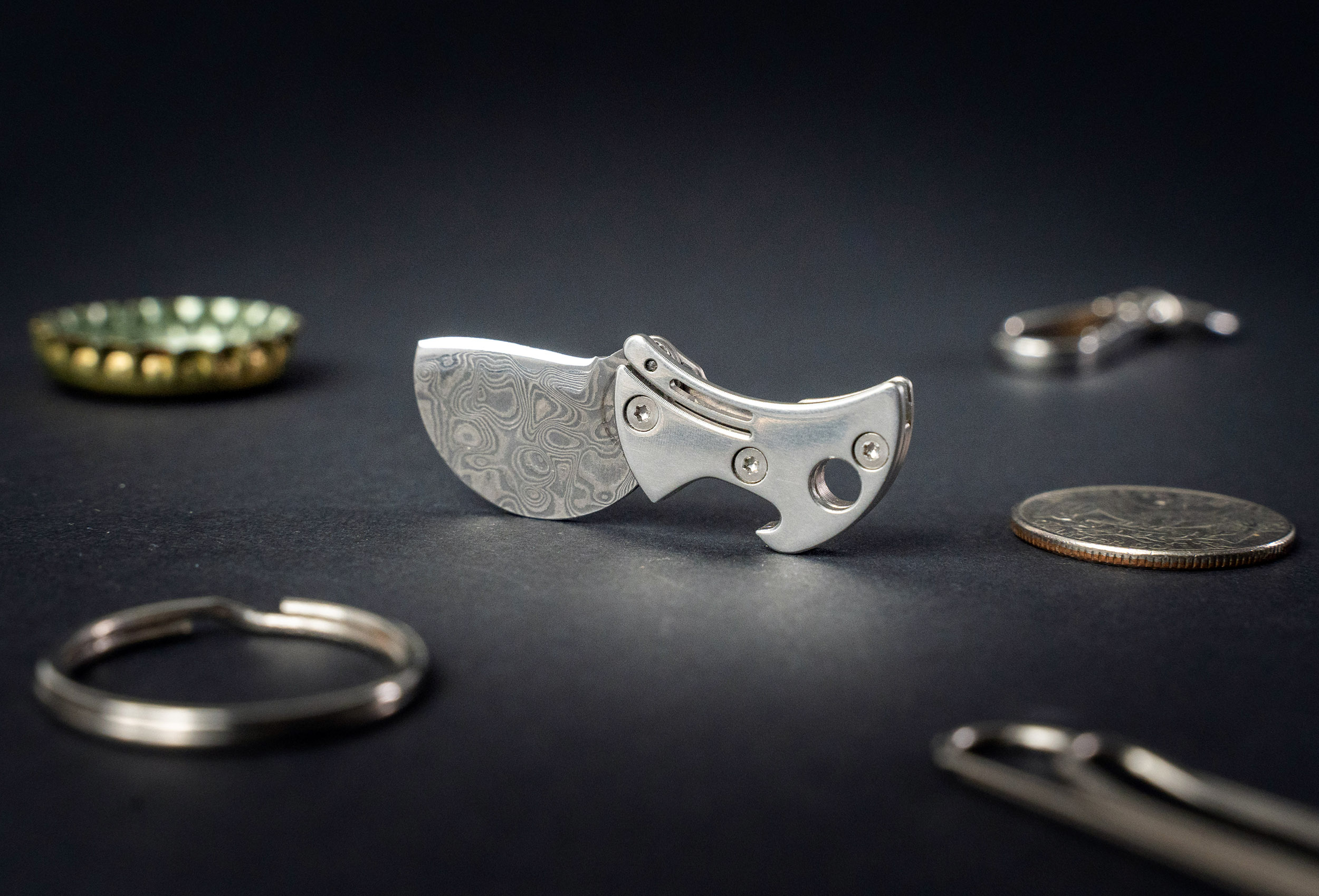 COiN tiny knife next to other items
