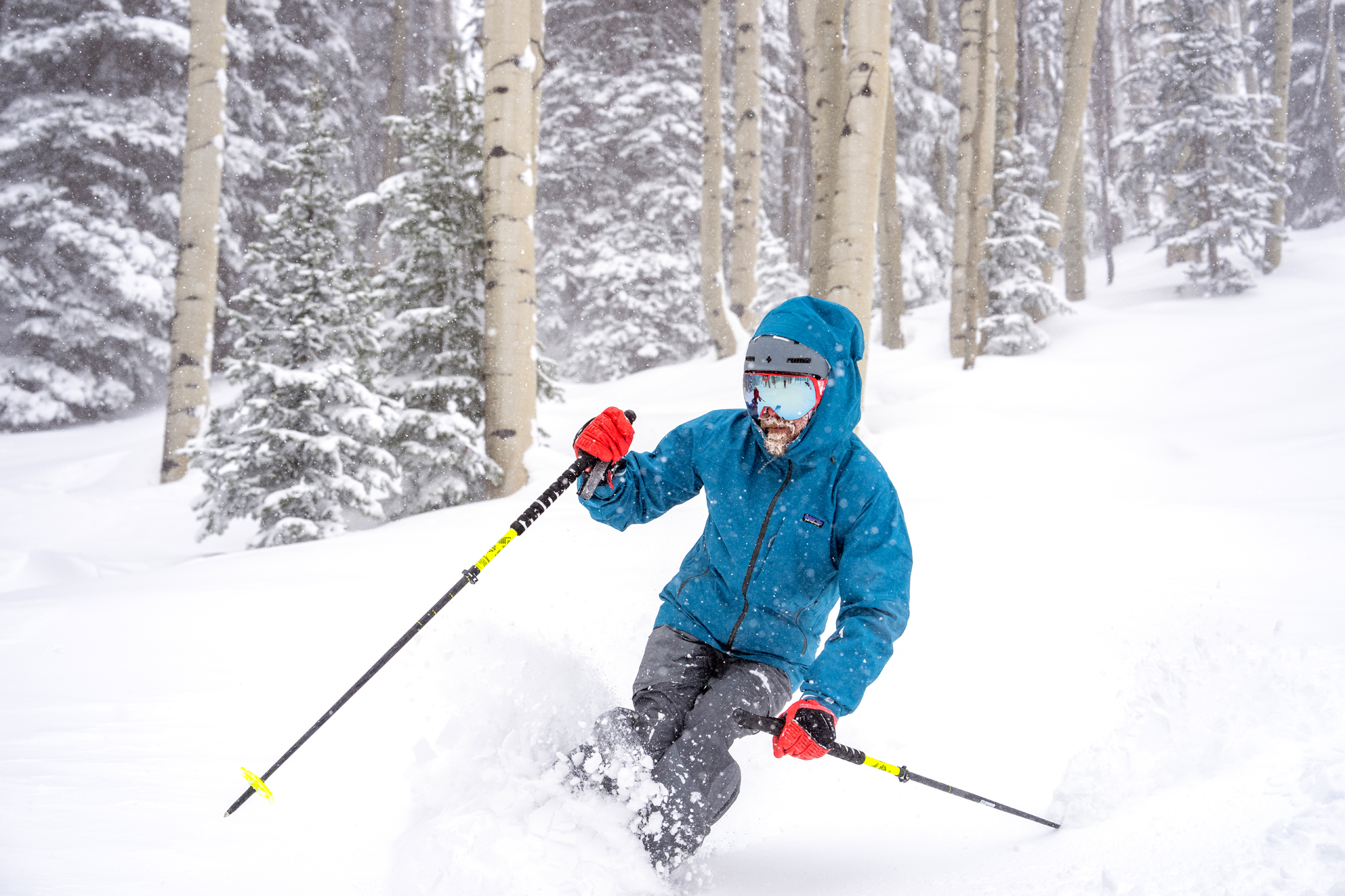 Sean McCoy skiing down powder run 