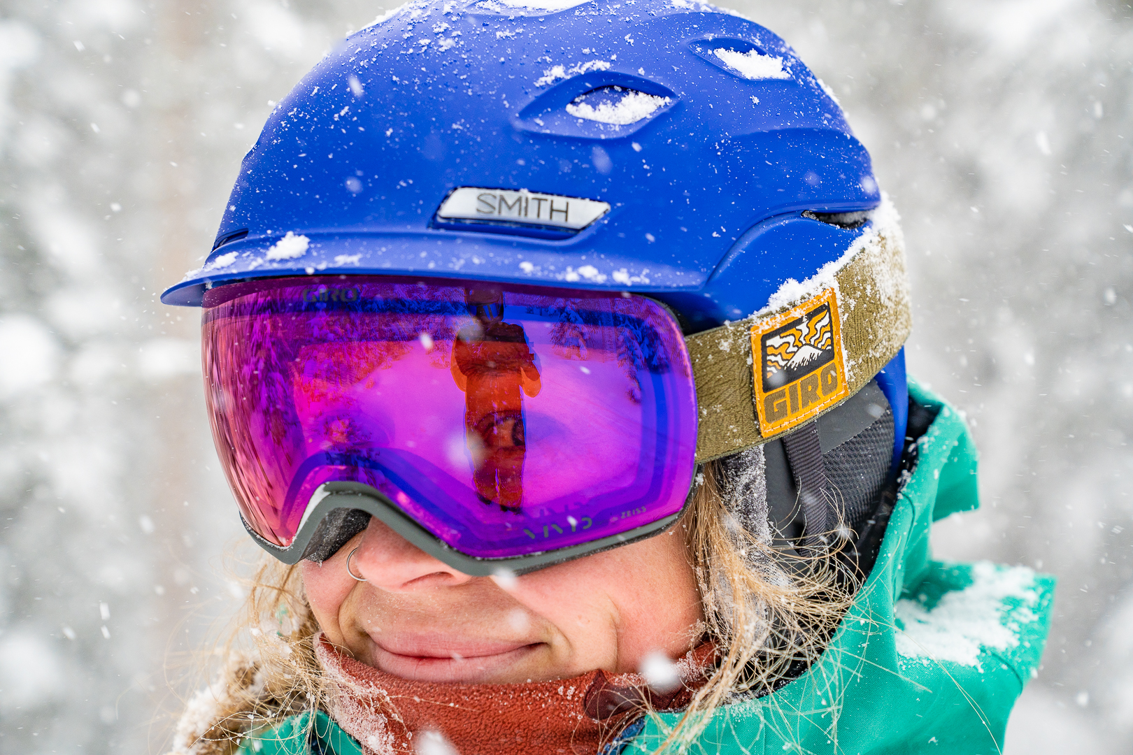 portrait of snow falling and woman looking through low light lens on snow goggles