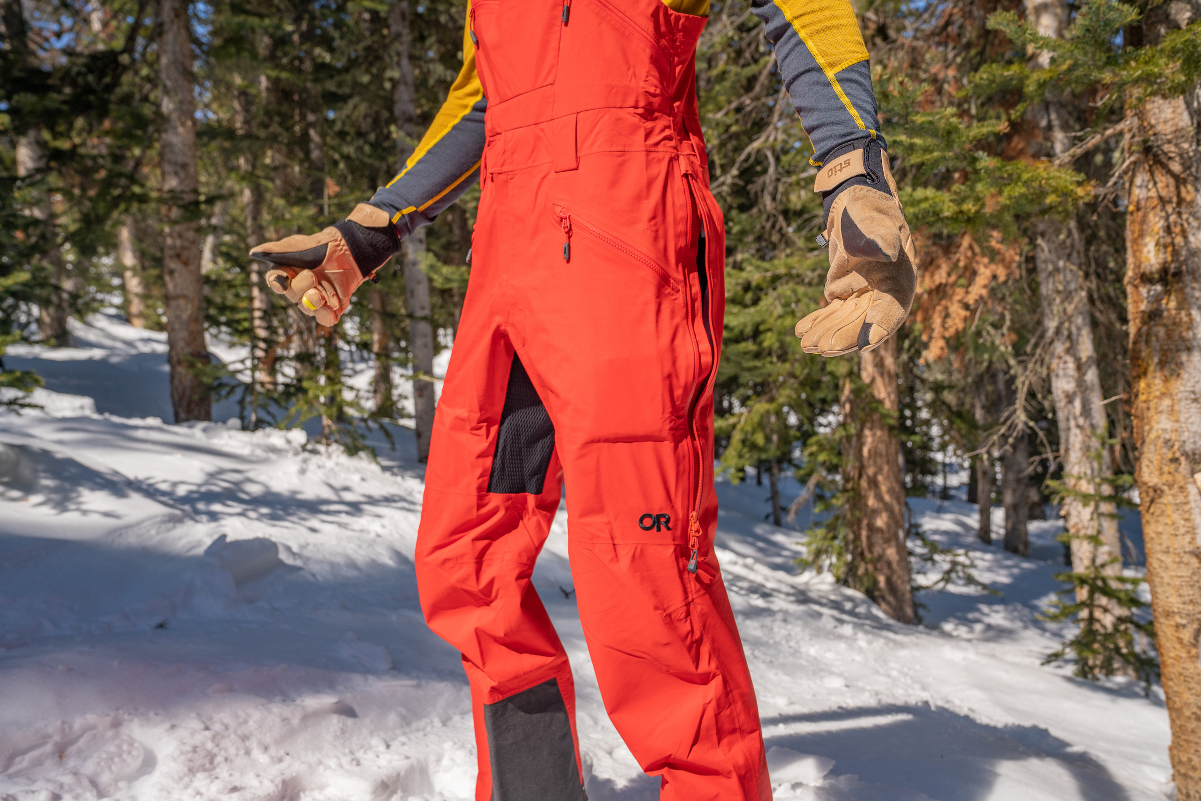 man wearing red OR bibs with vent open 
