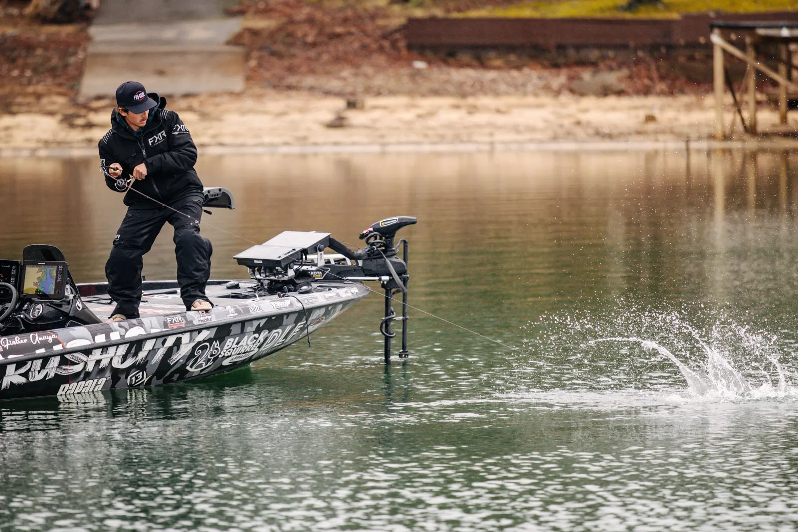 Fisher Anaya reels in a bass on Lake Martin