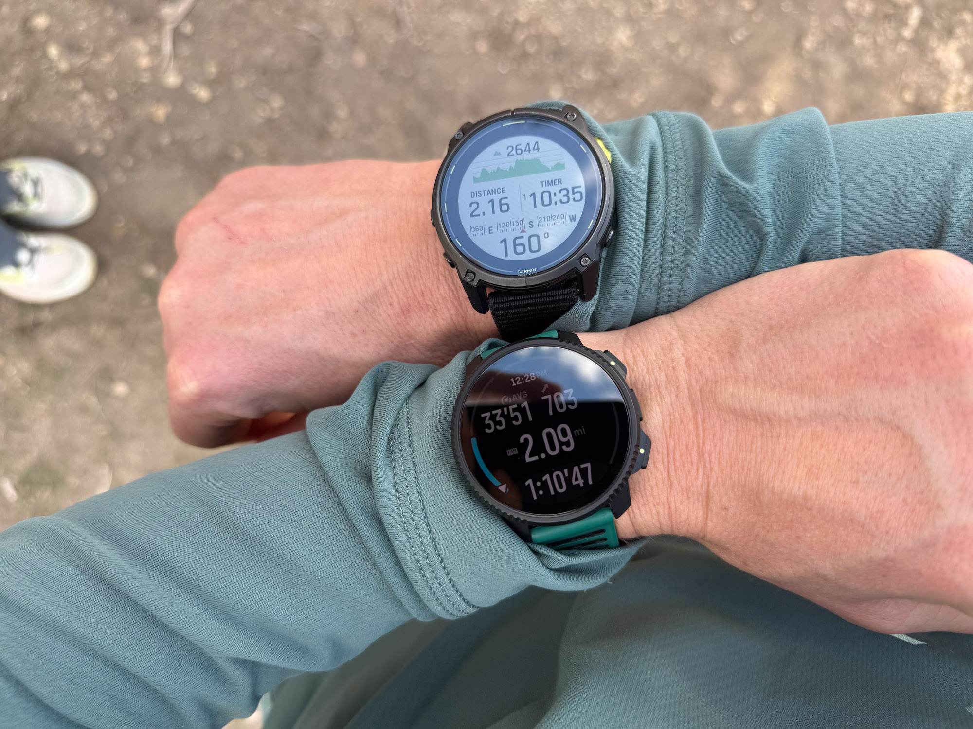 the author wearing the suunto vertical 2 and garmin enduro 3 side by side