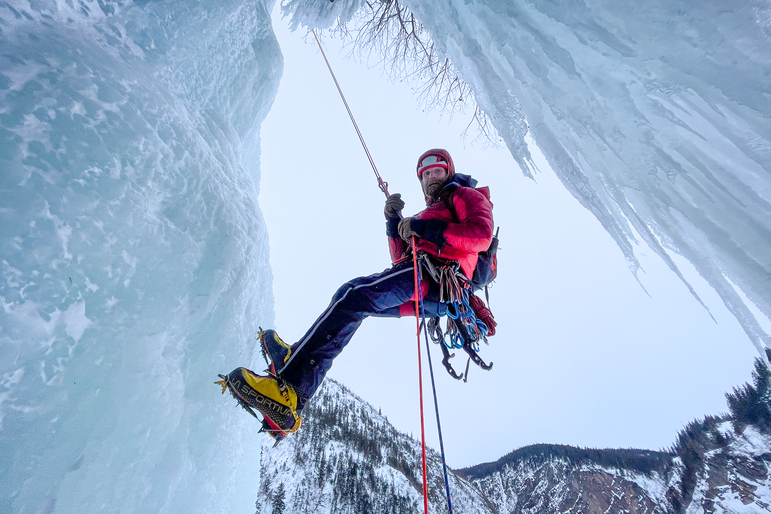Ice climber rappelling in Alaska