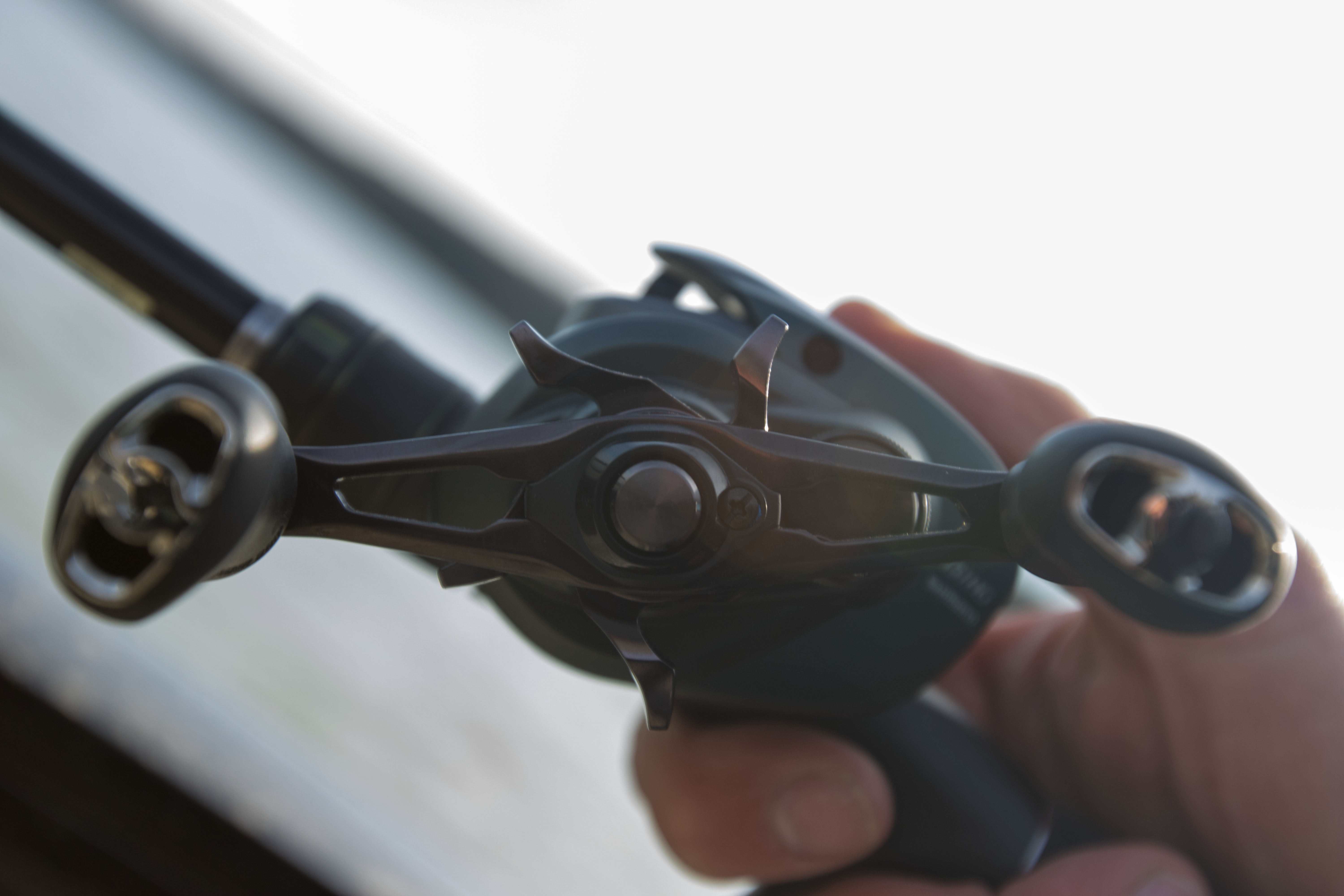 The handle of a bass fishing reel.