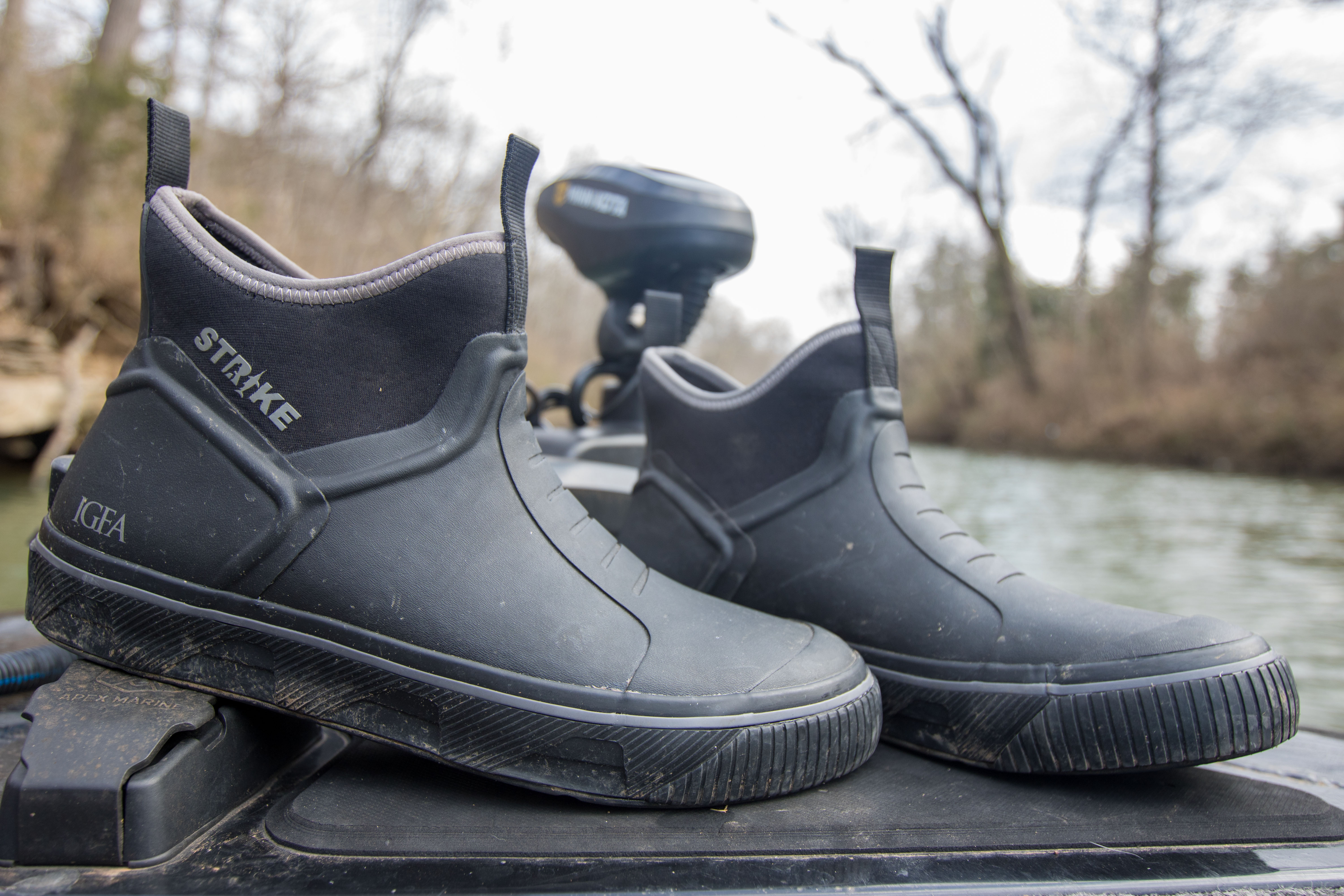 The strike Bigeye boot on the bow of a boat.