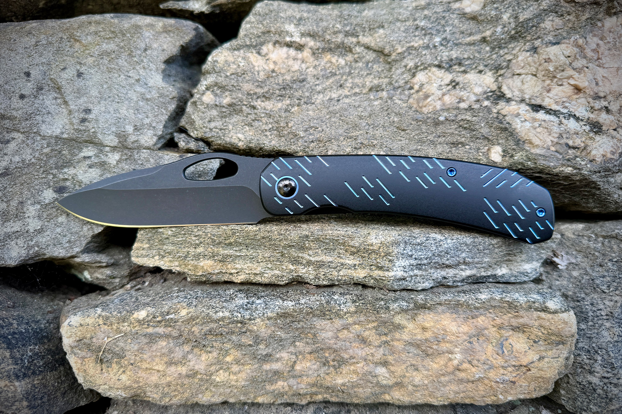 WE Knife Inmate placed on stacked stone