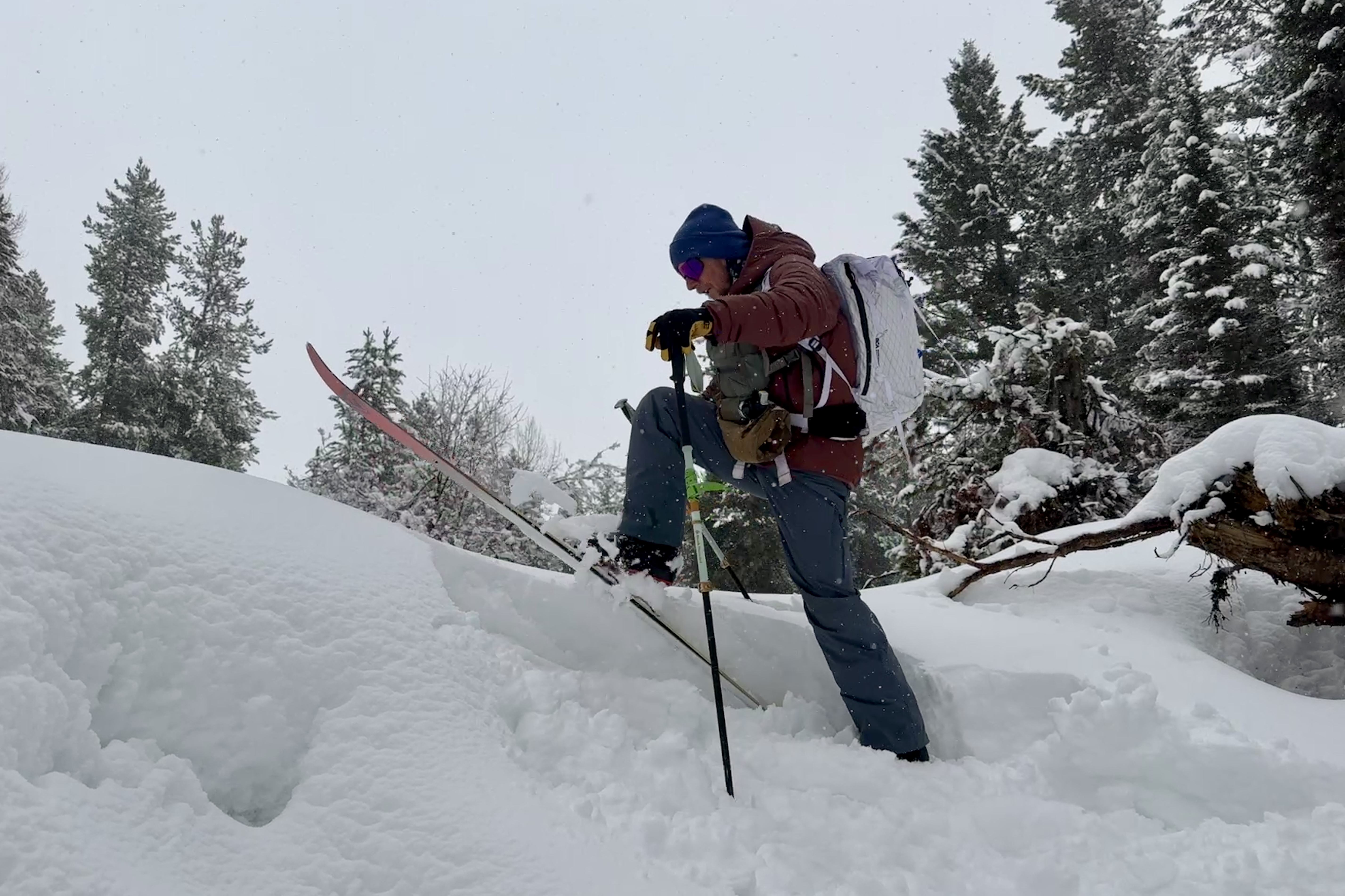 A skier climbs up a slope on the Rossignol XP 105 Positrack ski