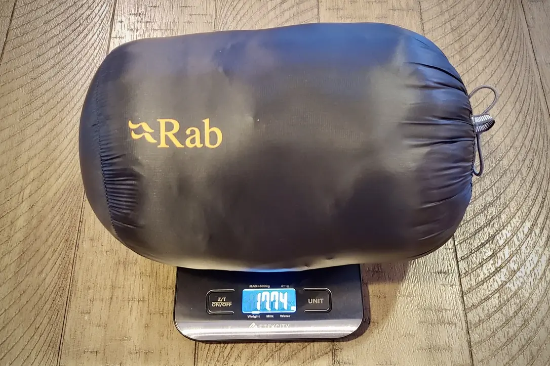 Rab Mythic G down jacket on a digital scale