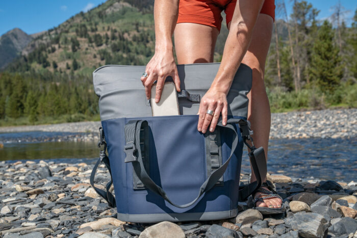 sliding phone into tote side pocket