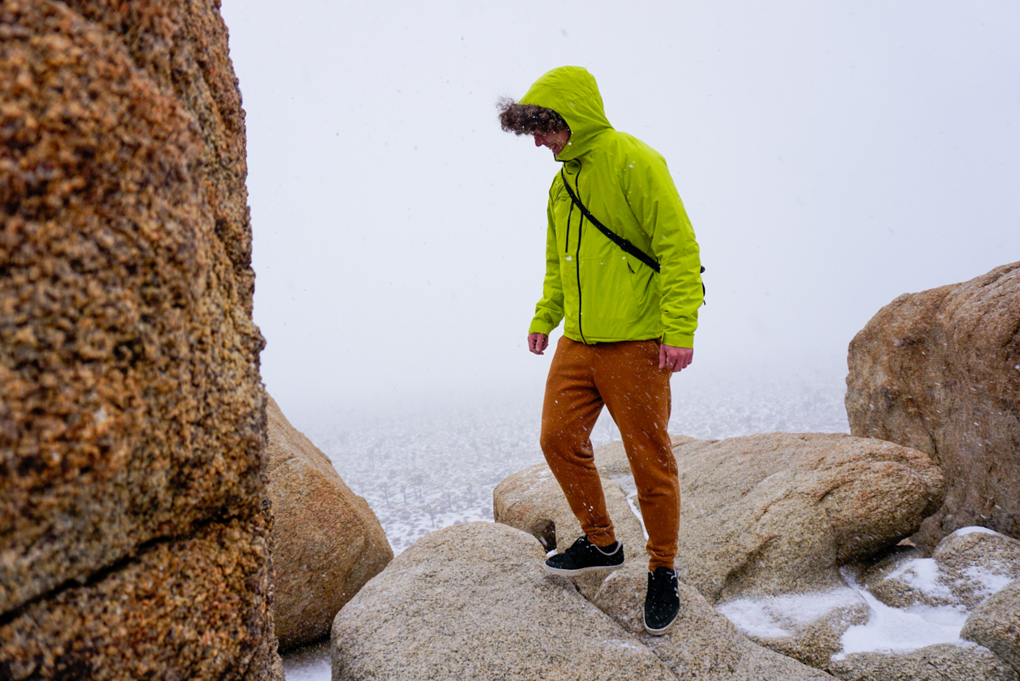 Hiker Wearing the Mountain Hardware Stretch Ozonic Rain Jacket in Joshua Tree National Park