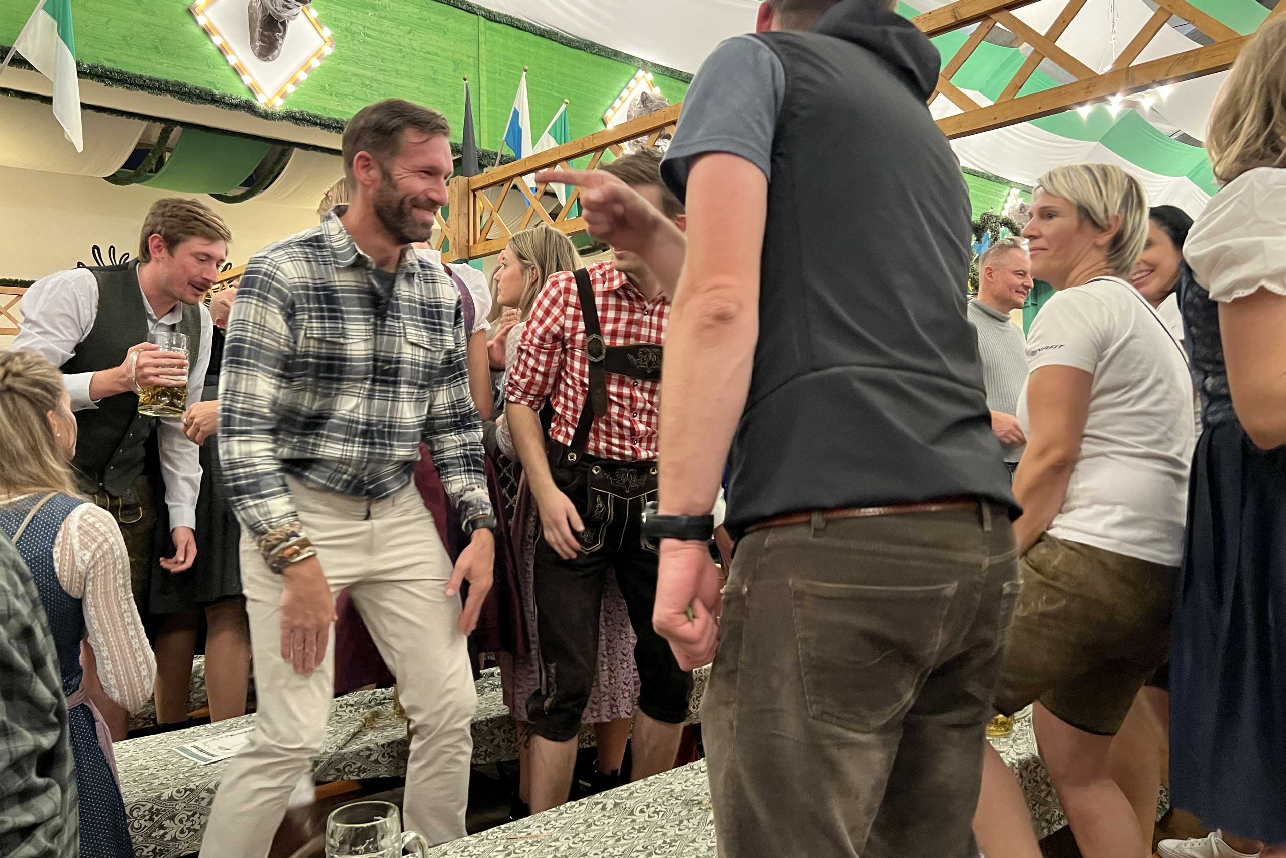 the author at octoberfest challenging the DWR finish of travel pants