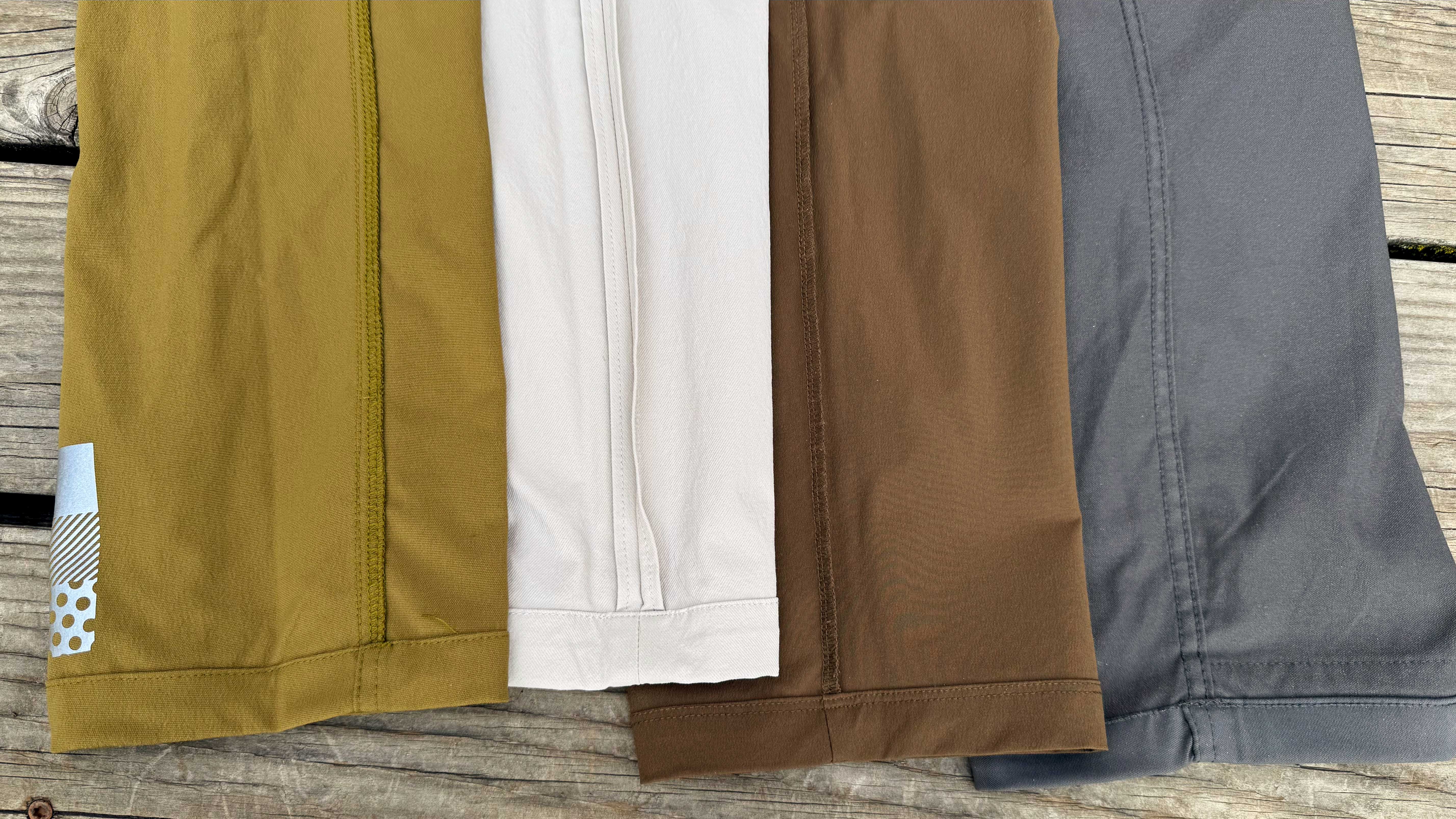 four pairs of travel pants turned inside out to show the stitching inside