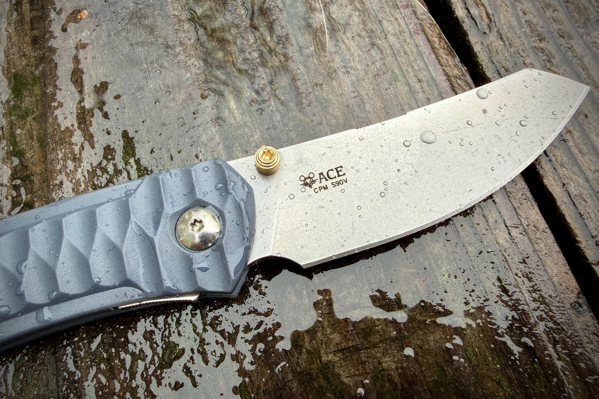 Close view of the ACE Iona Sailor blade showing water droplets on the CPM S90V steel