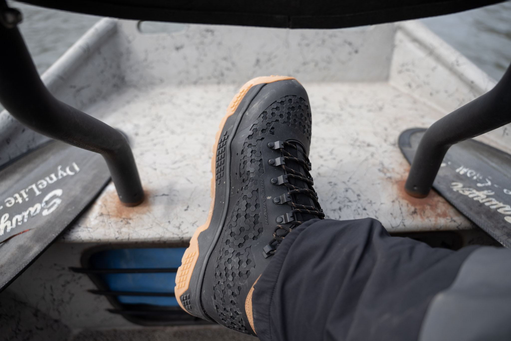 A wading boot on a drift boat.