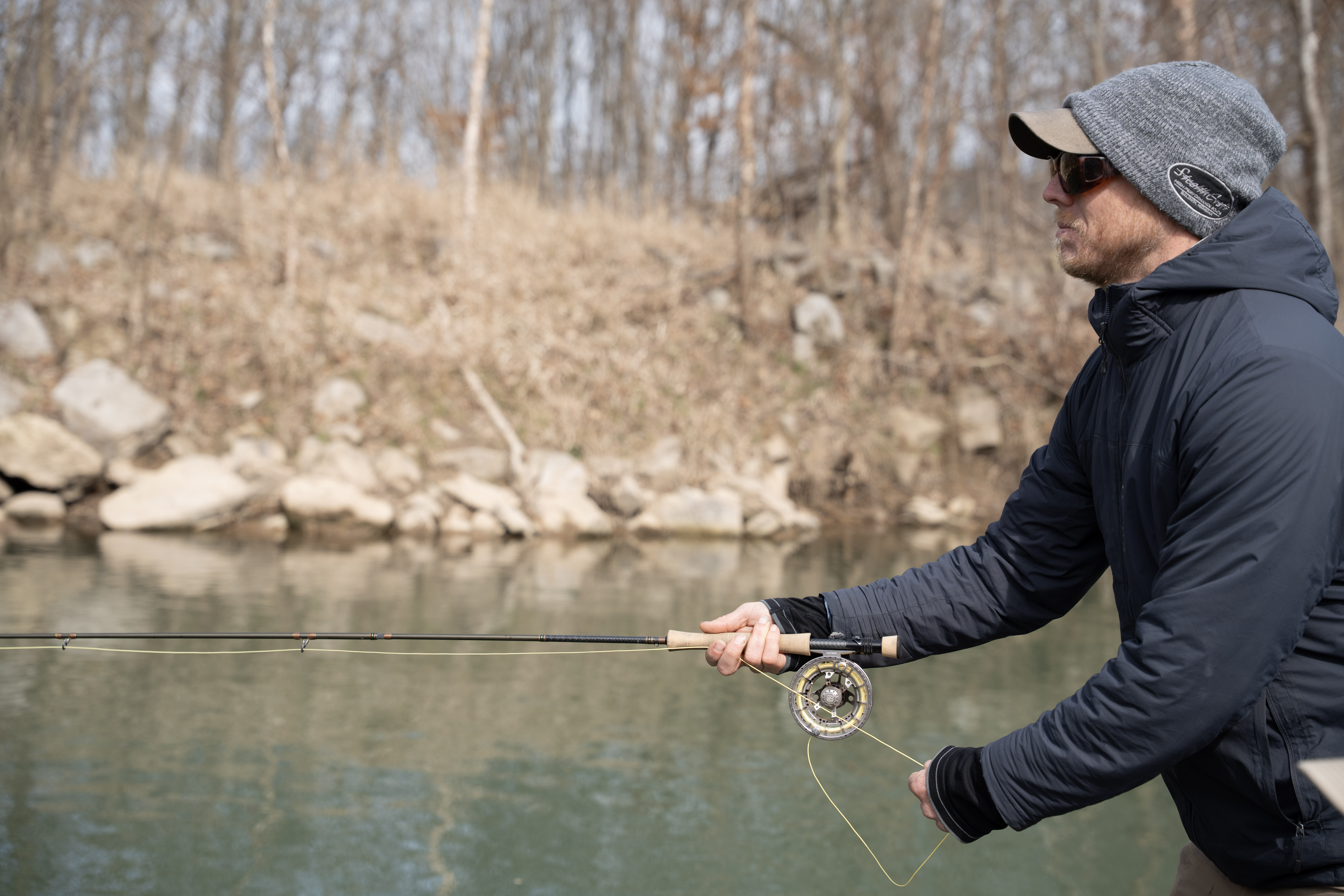 An angler stripping in fly line.