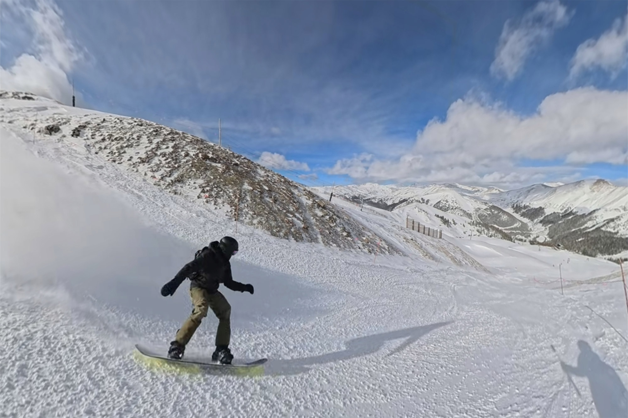 The LT Supermatic bindings are used while carving down a wide alpine groomer