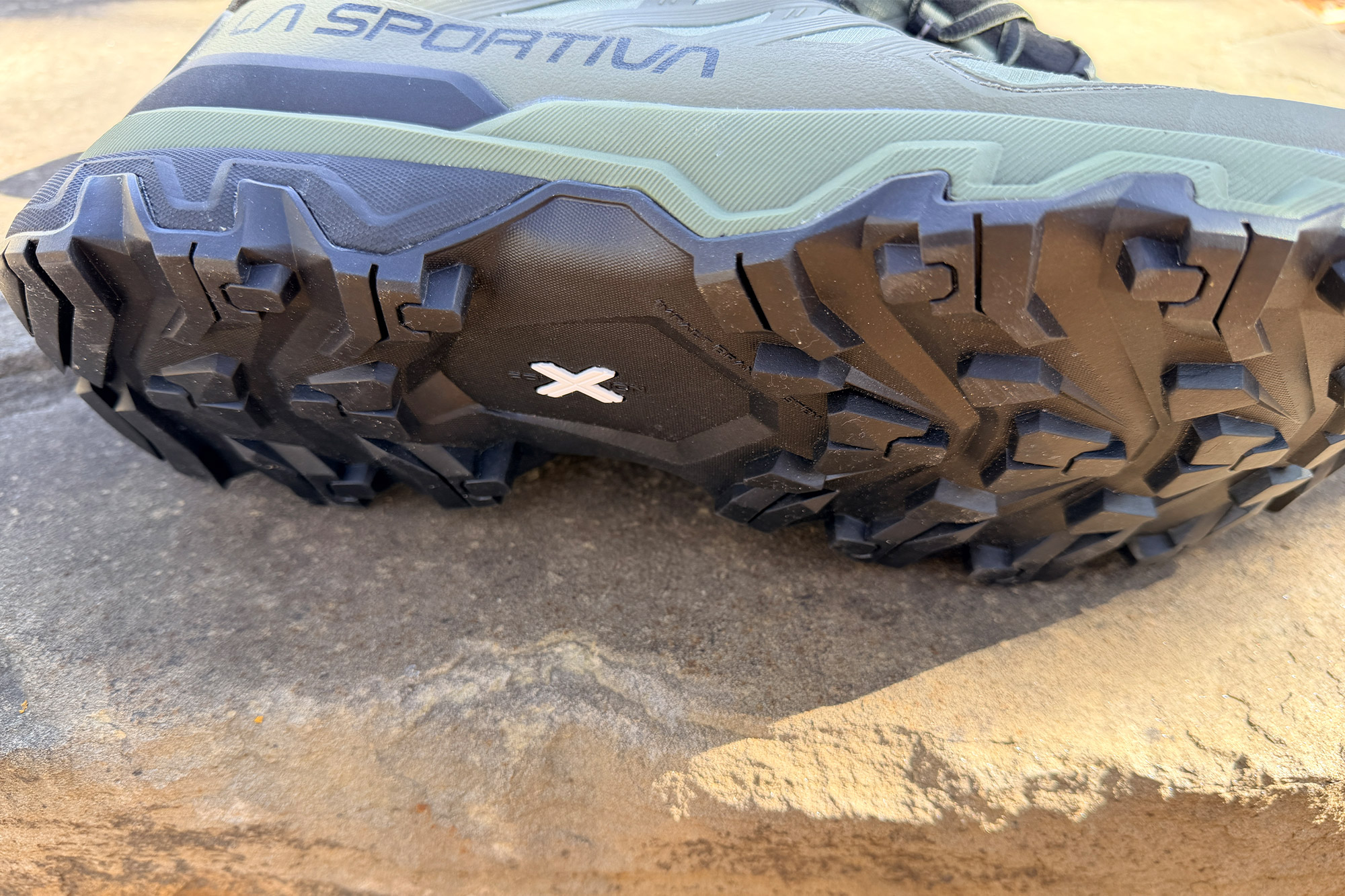 Close up of hiking shoe outsole showing deep traction lugs