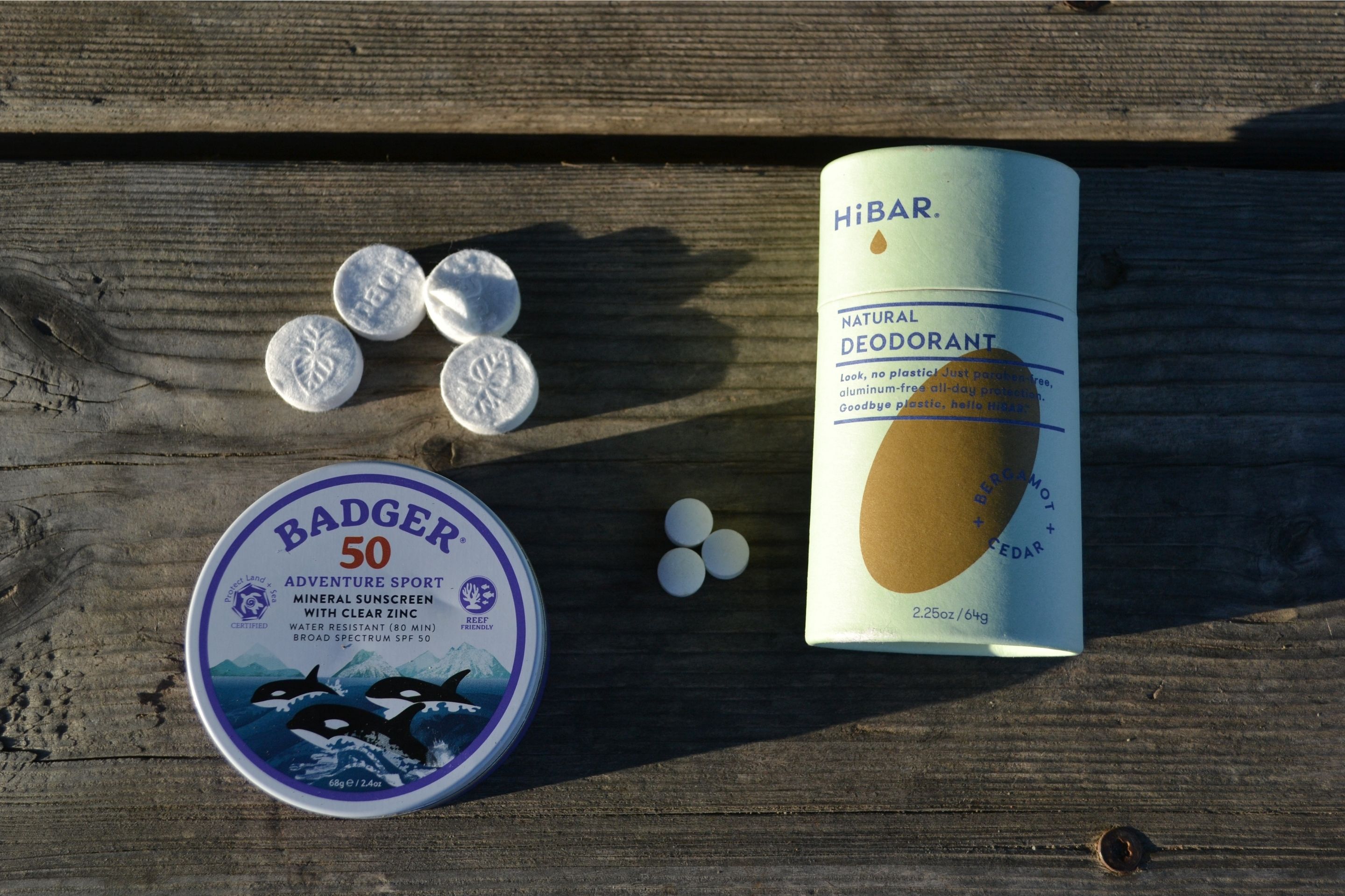 sunscreen and deoderant on picnic table