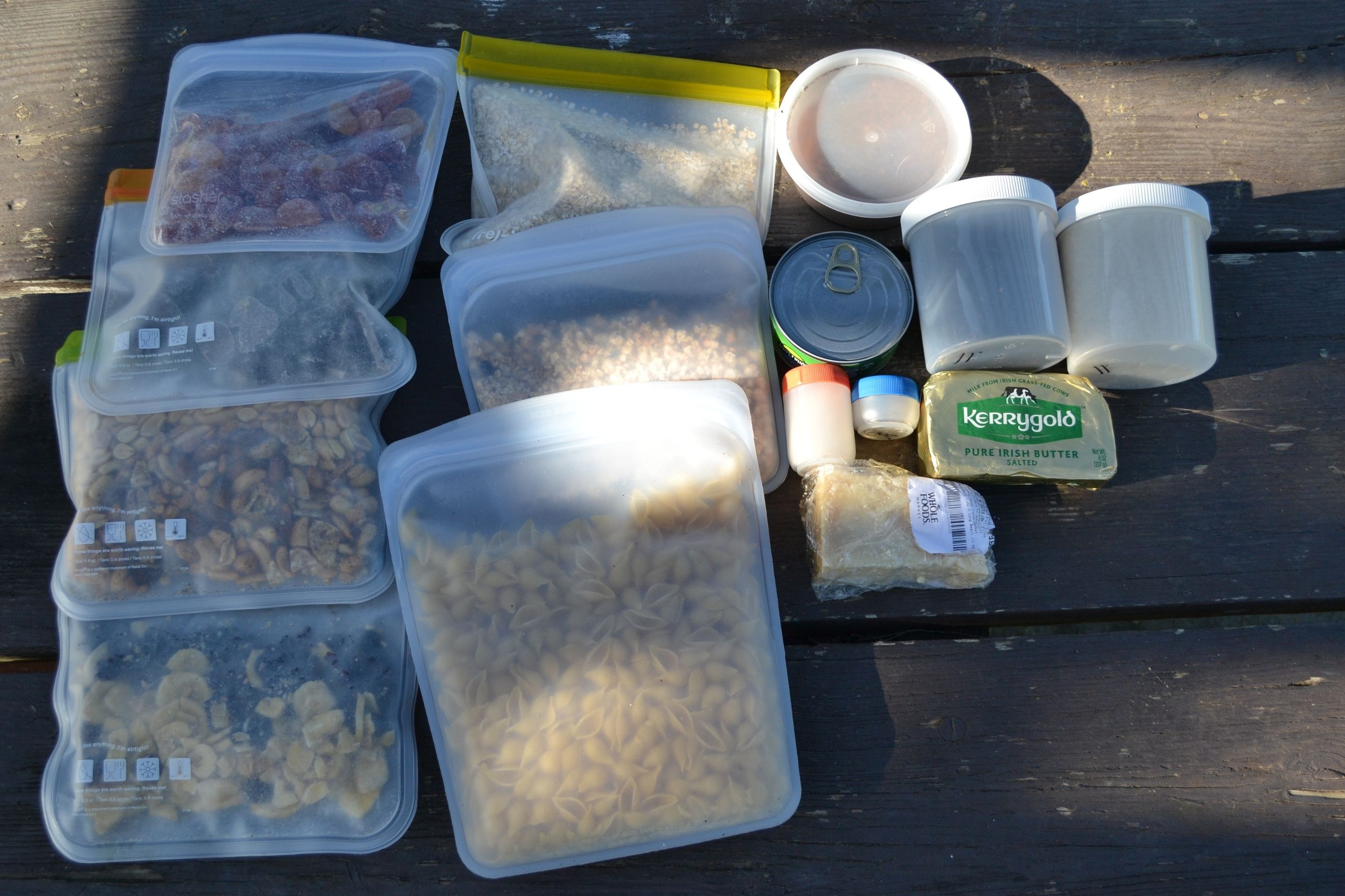 series of plastic bags and containers filled with food