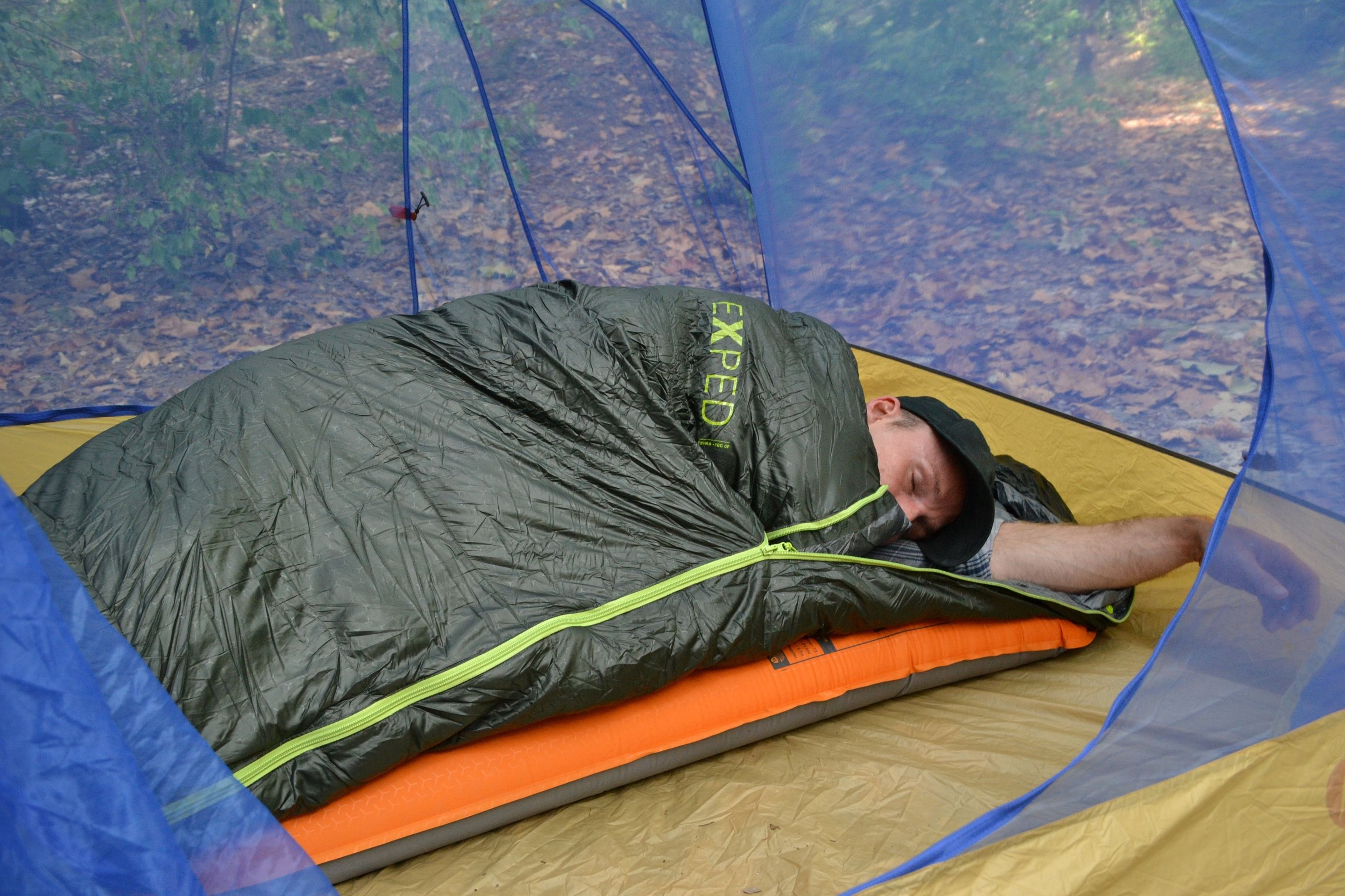 person asleep in tent
