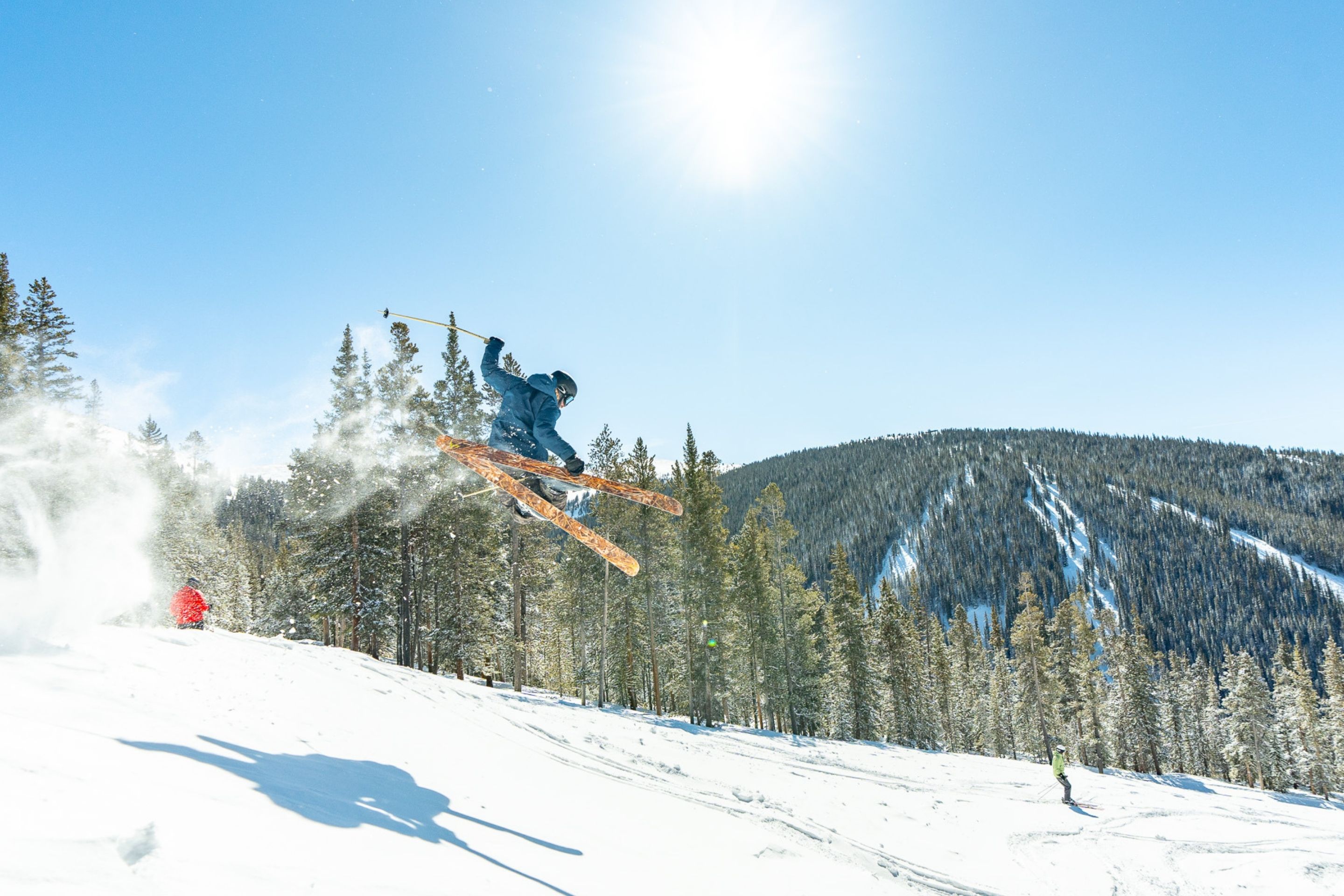 skier jumps down hill 