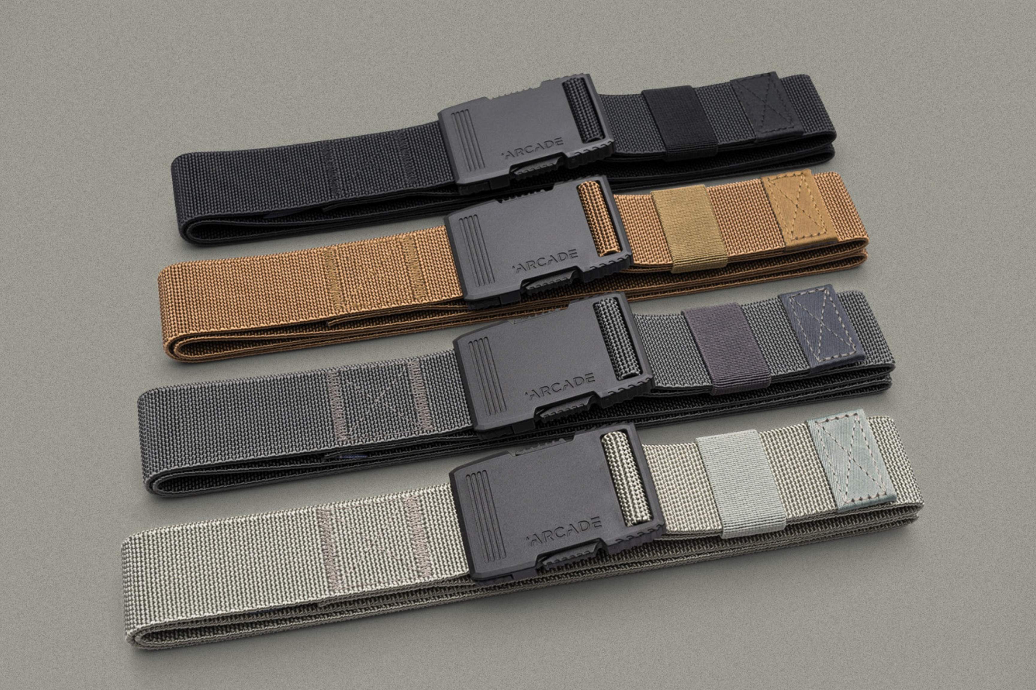 series of four belts on gray surface