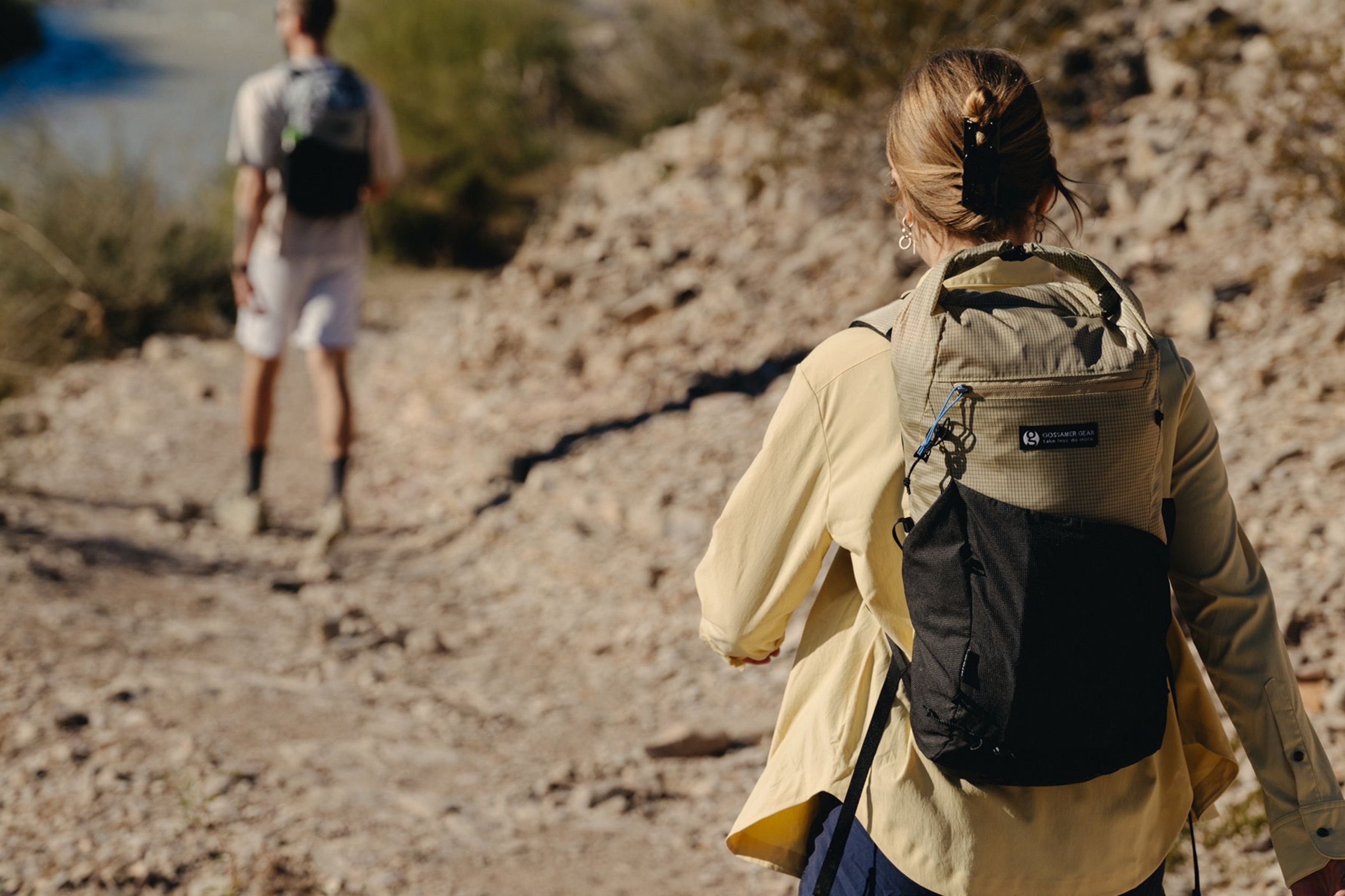 two hikers on desert trail