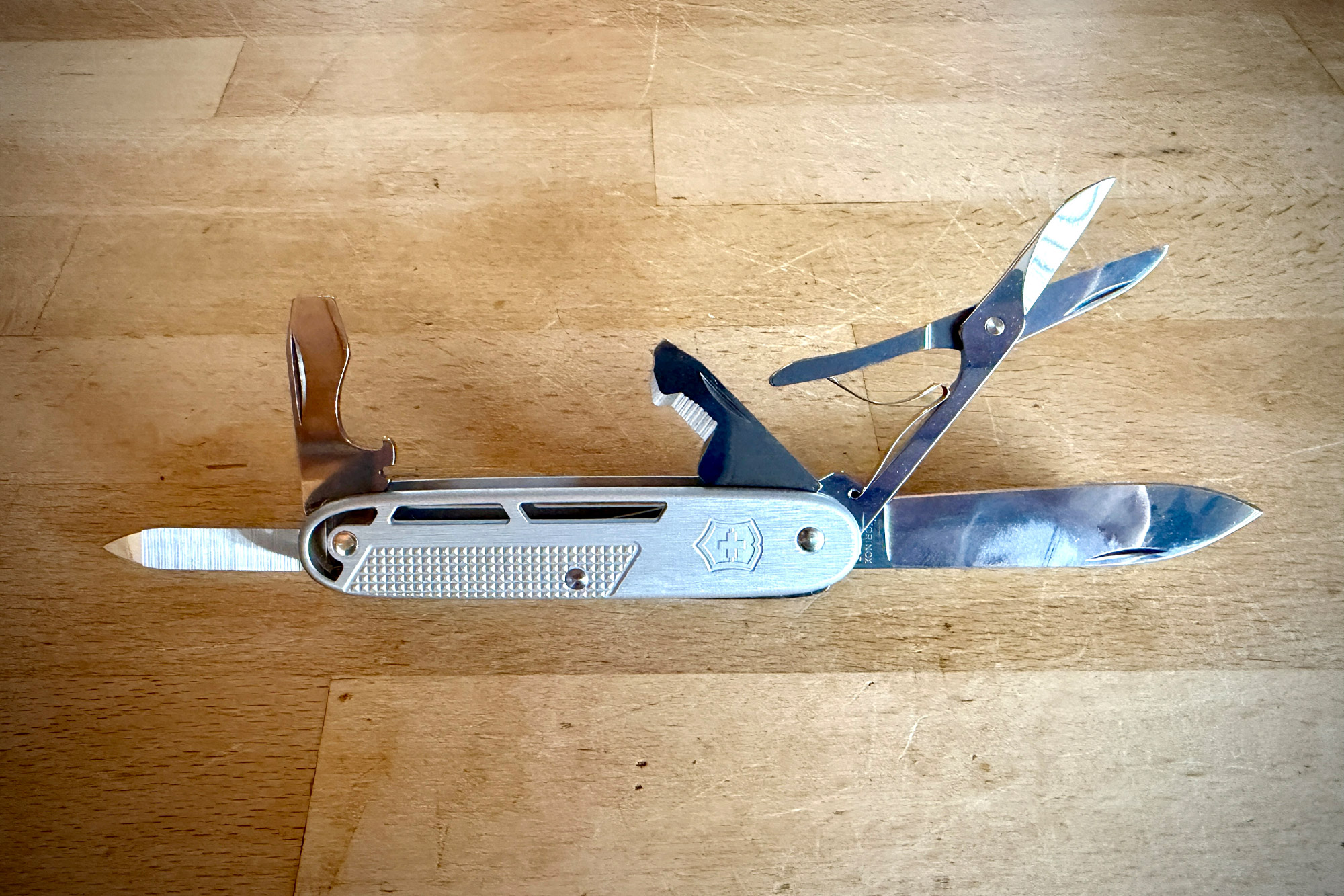 Victorinox Synergy X Alox with blade, scissors, bottle opener, and other tools extended