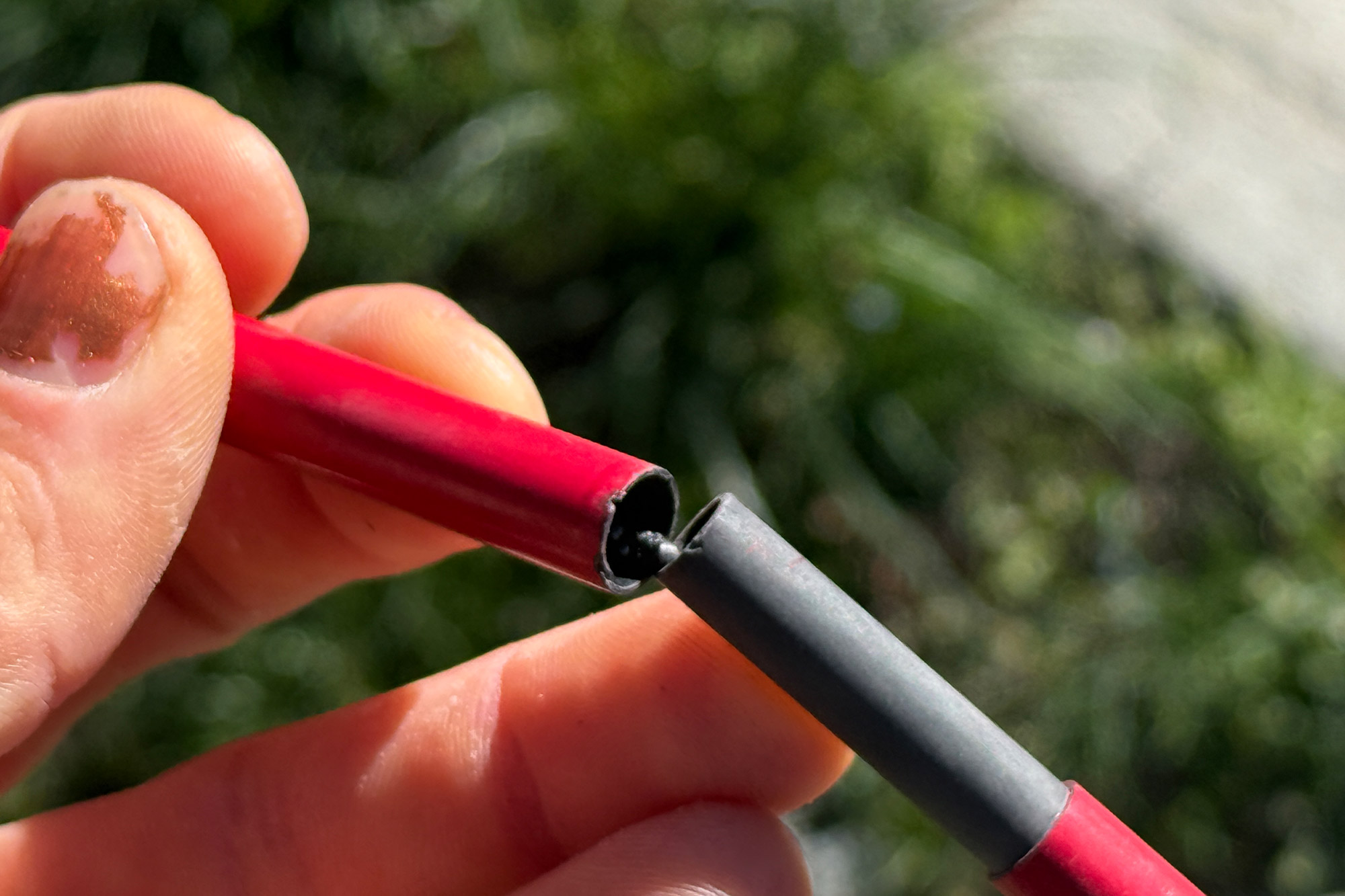 Close-up of tent pole segment connection showing internal cord system