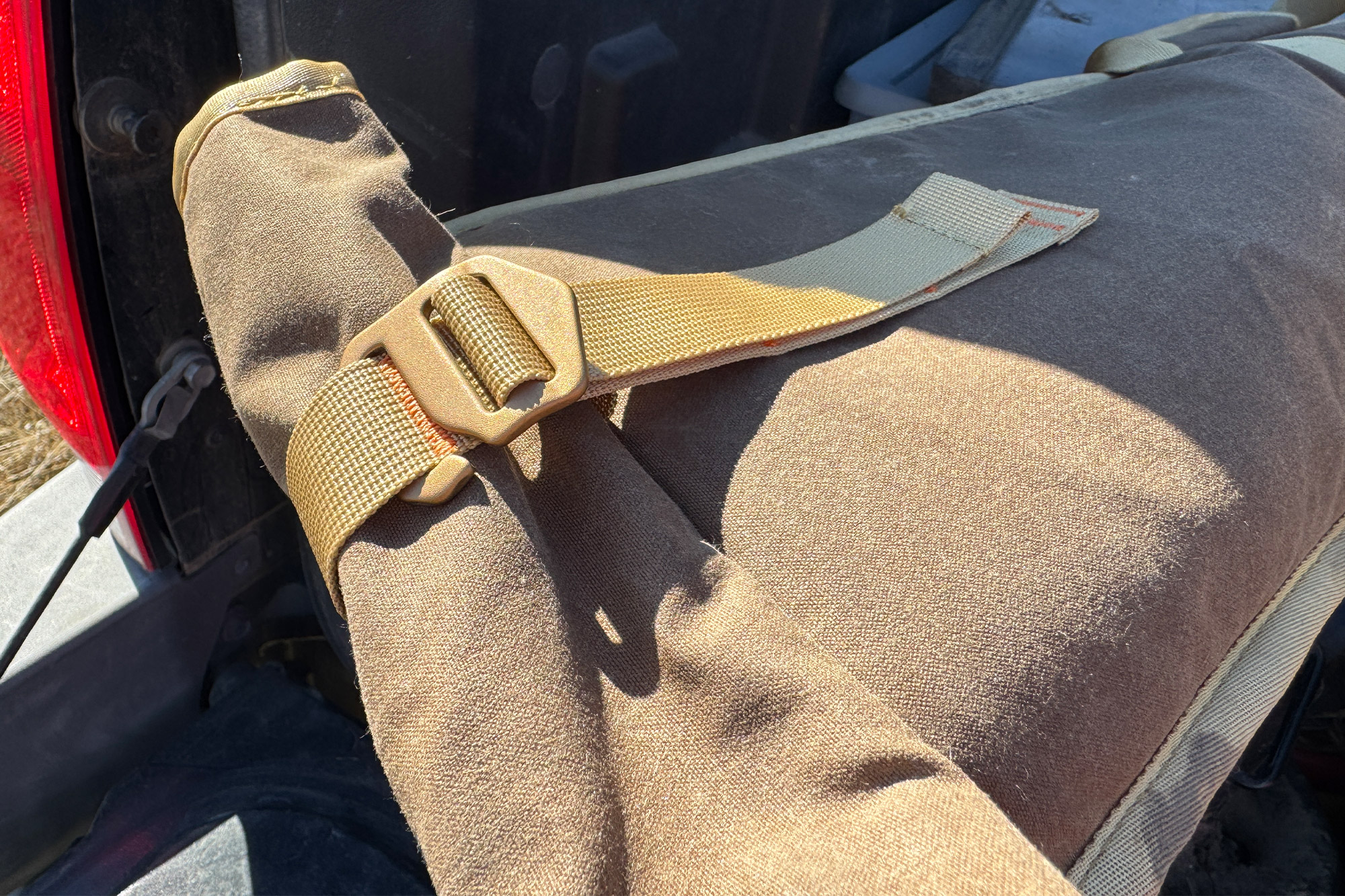 Duck Camp sleeve showing buckle and strap detail in sunlight