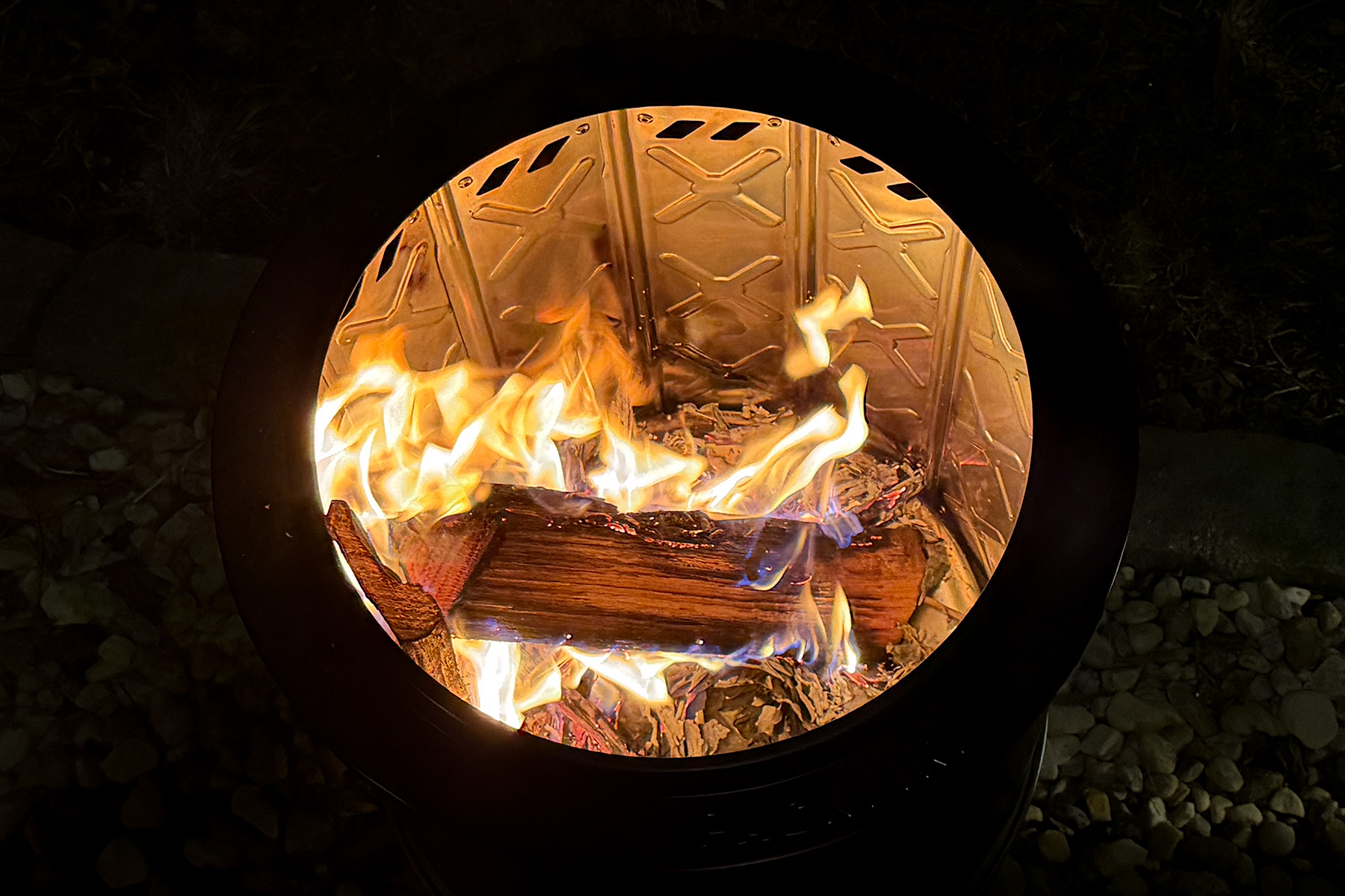 inside of fire pit with burning log