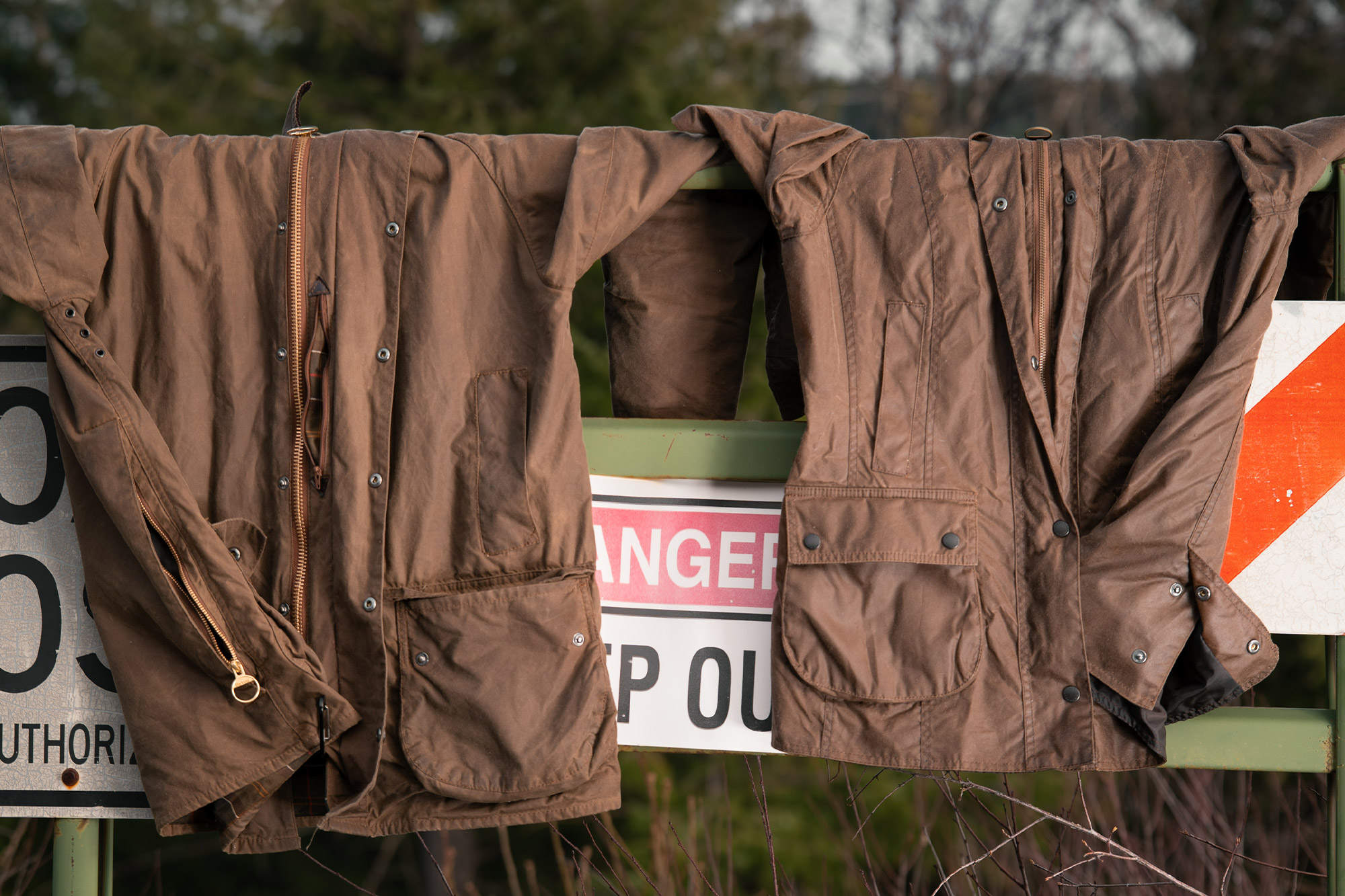 Two waxed jackets displayed side by side, including the Barbour Beaufort Wax Jacket