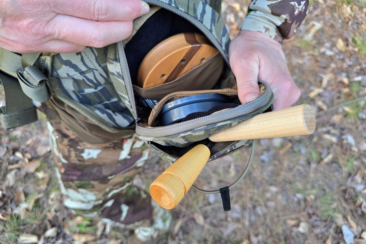 The Flydown system pocket is opened to show multiple turkey calls stored inside