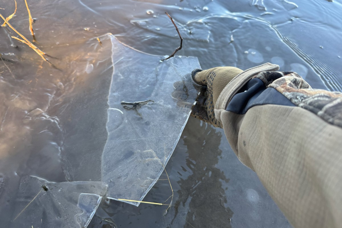 Pro wool gloves grip and break thin ice on a frozen surface