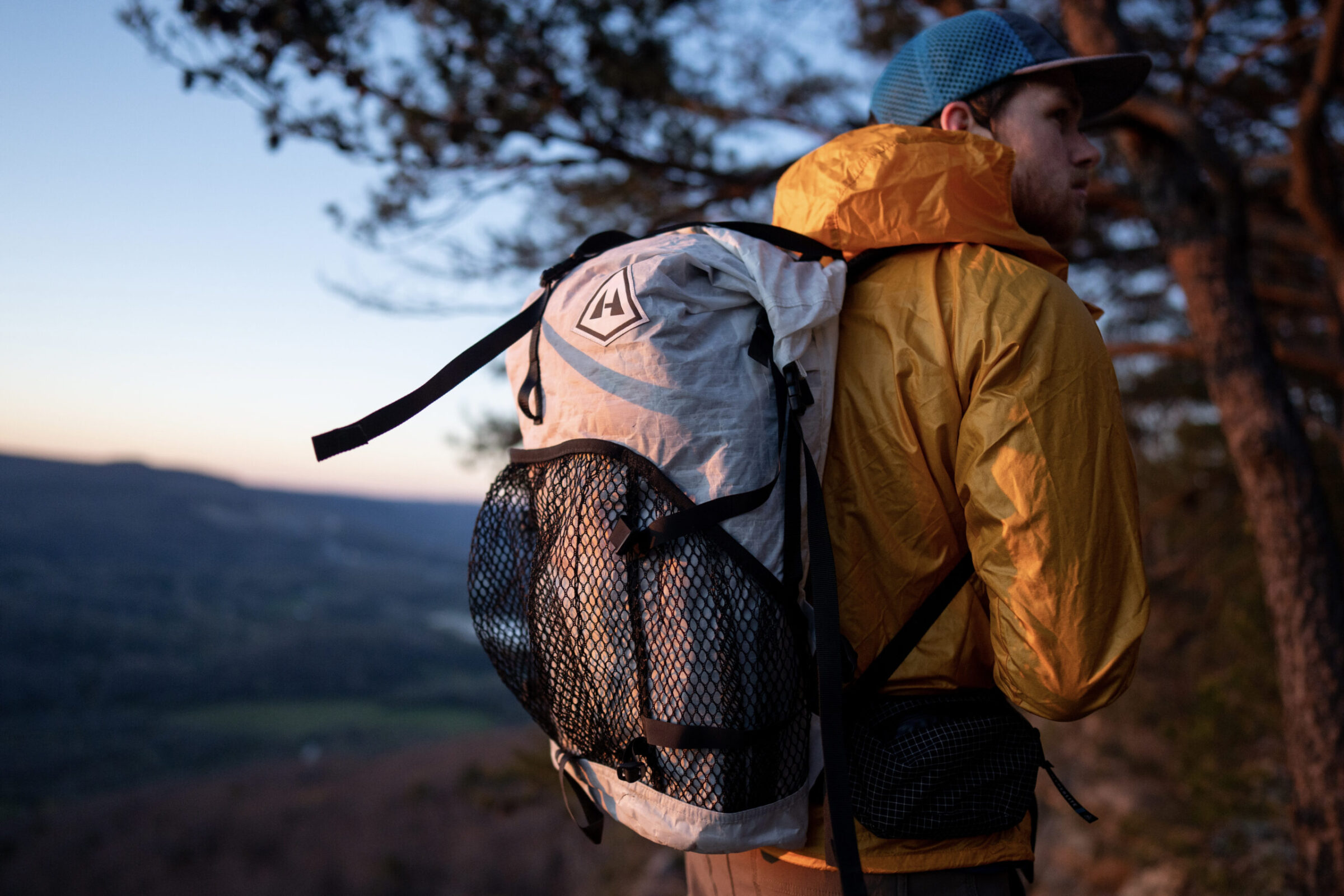 a gearjunkie tester wearing an hmg pack at sunset