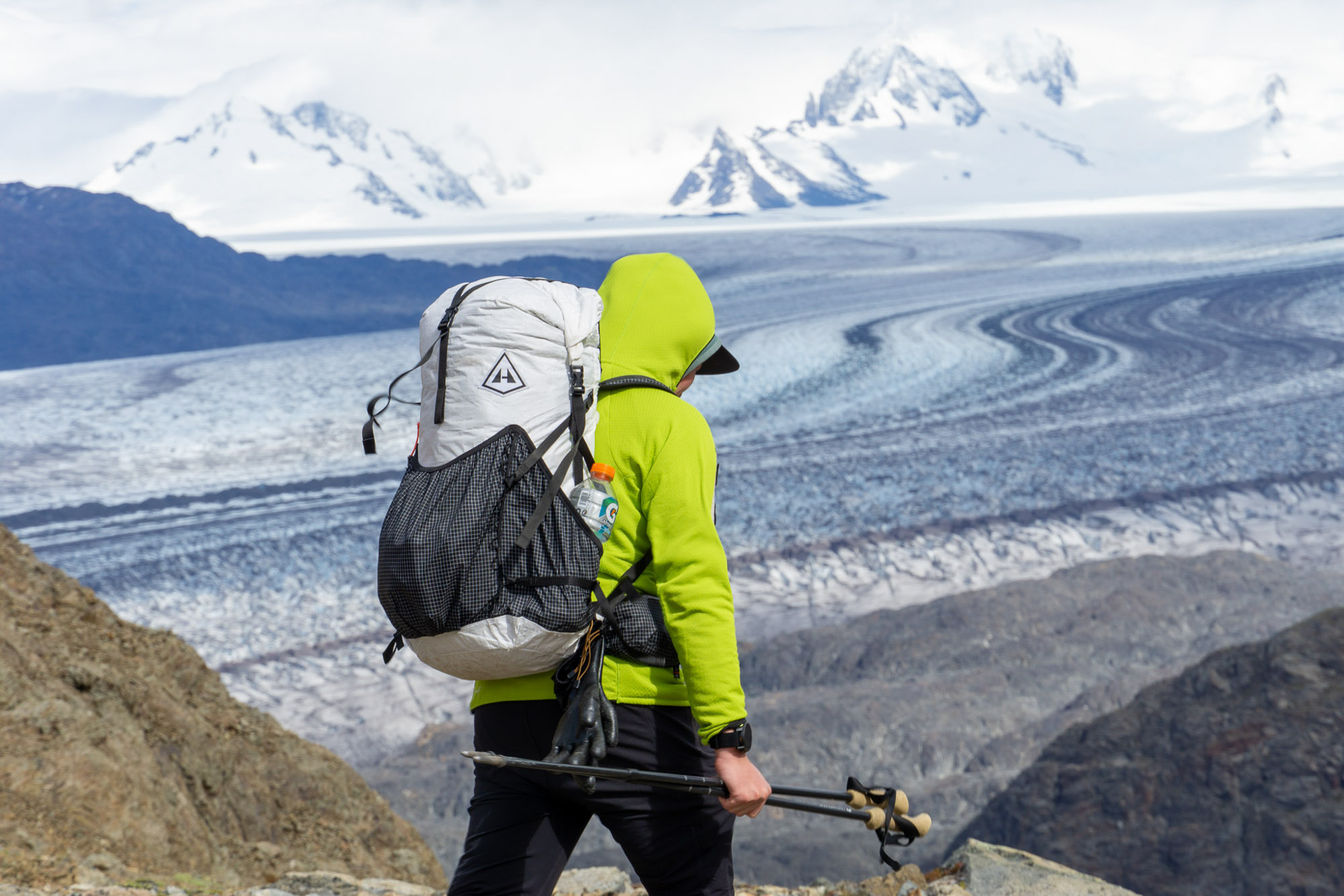 a backpacker wearing the hyperlite mountain gear southwest pack traverses in front of the patagonian icefield