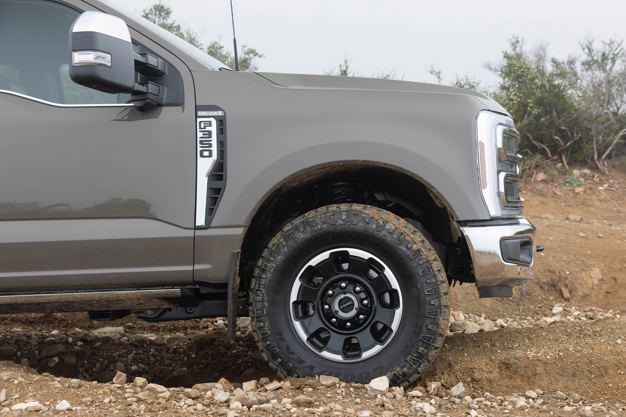 Front wheel and tire of the Ford F 350 King Ranch Tremor on a rocky trail