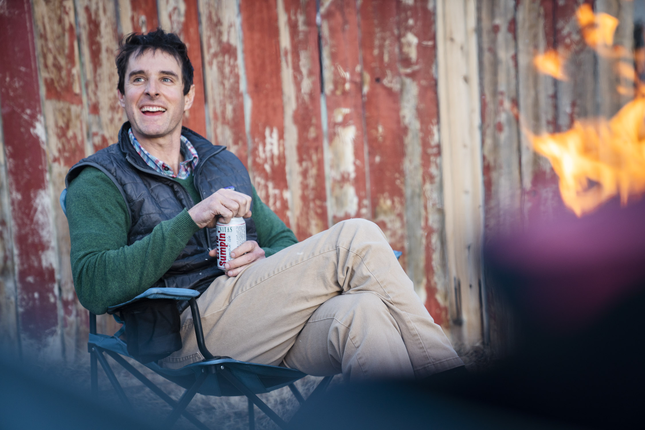 Man Sitting in REI Co-op Skyward Chair Around the Campfire
