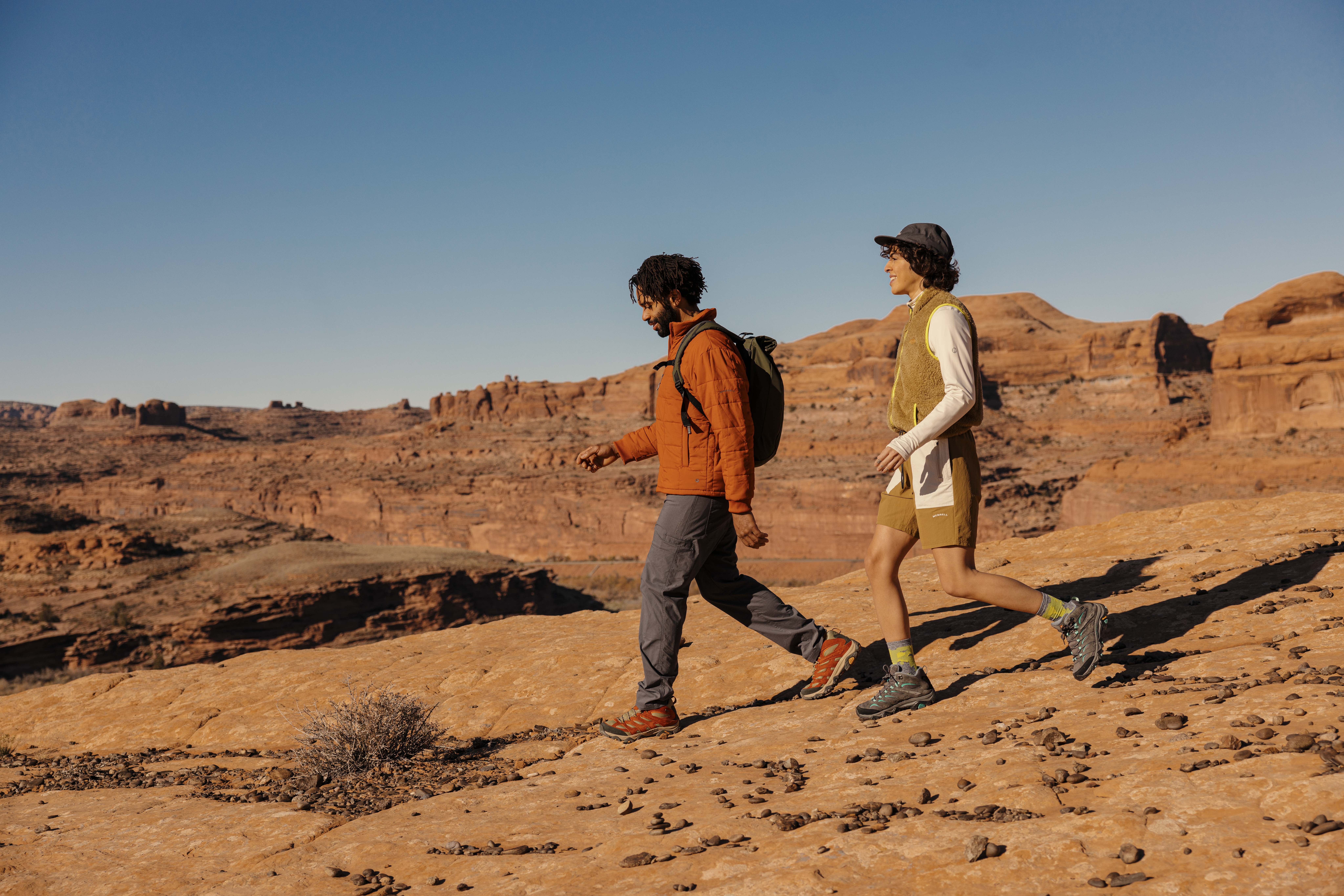 two people walking through the desert in Merrel Moab 3s