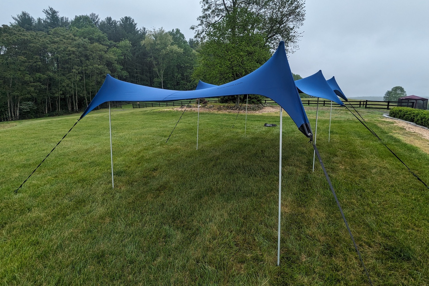 The Neso Party Tent set up on a large grass lawn