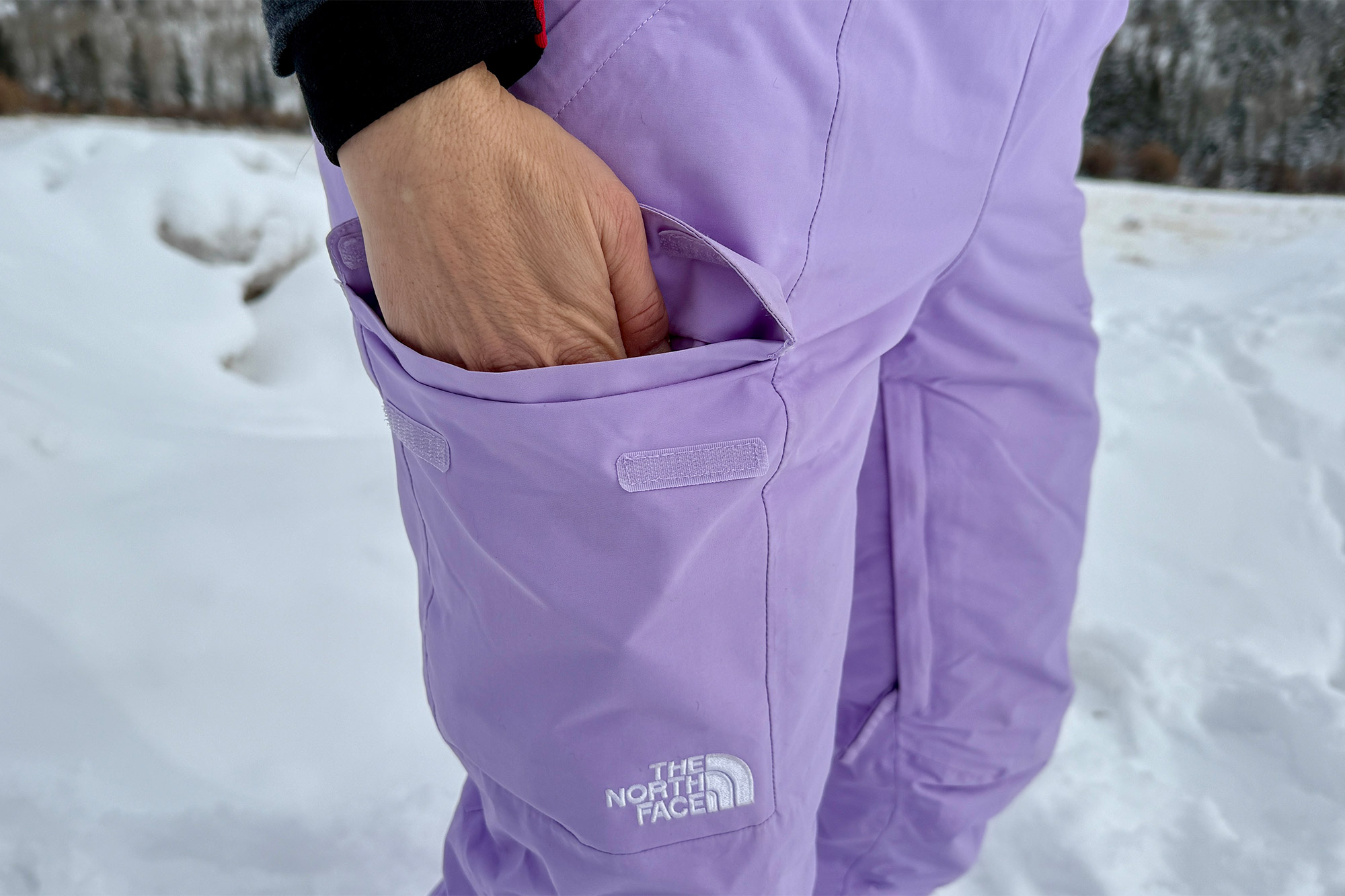 Detail of the pocket on the North Face Freedom bibs with the logo visible on the fabric