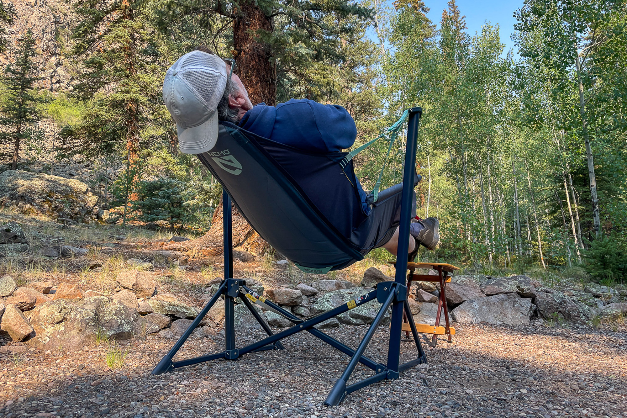 a camper sits back in the nemo stargaze evo-x camp chair